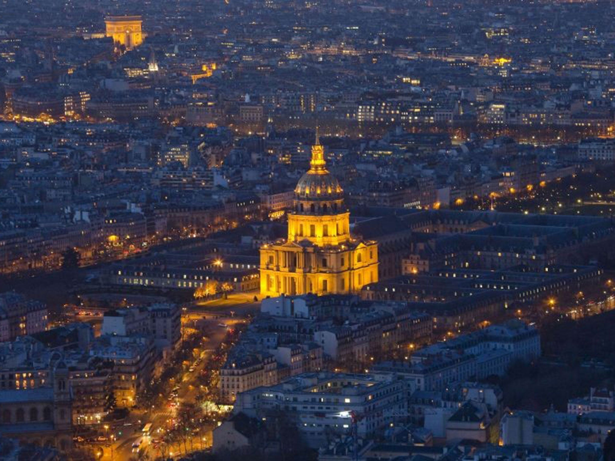 Drones have appeared over French landmarks in Paris for a second night in a row (pictured: the Invalides and the Arc de Triomphe on 24 February)