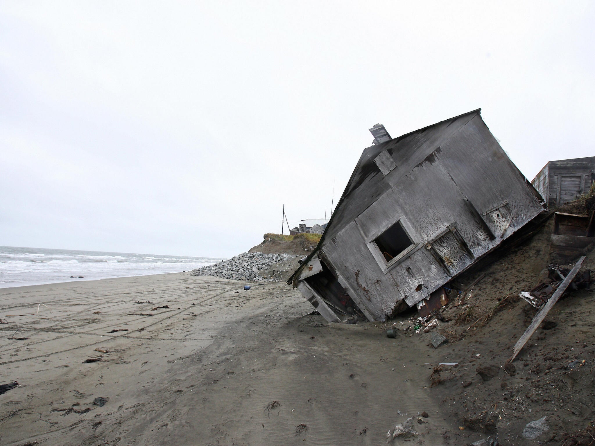 This 2006 image shows a home in the Alaskan village of Shishmaref destroyed by climate change