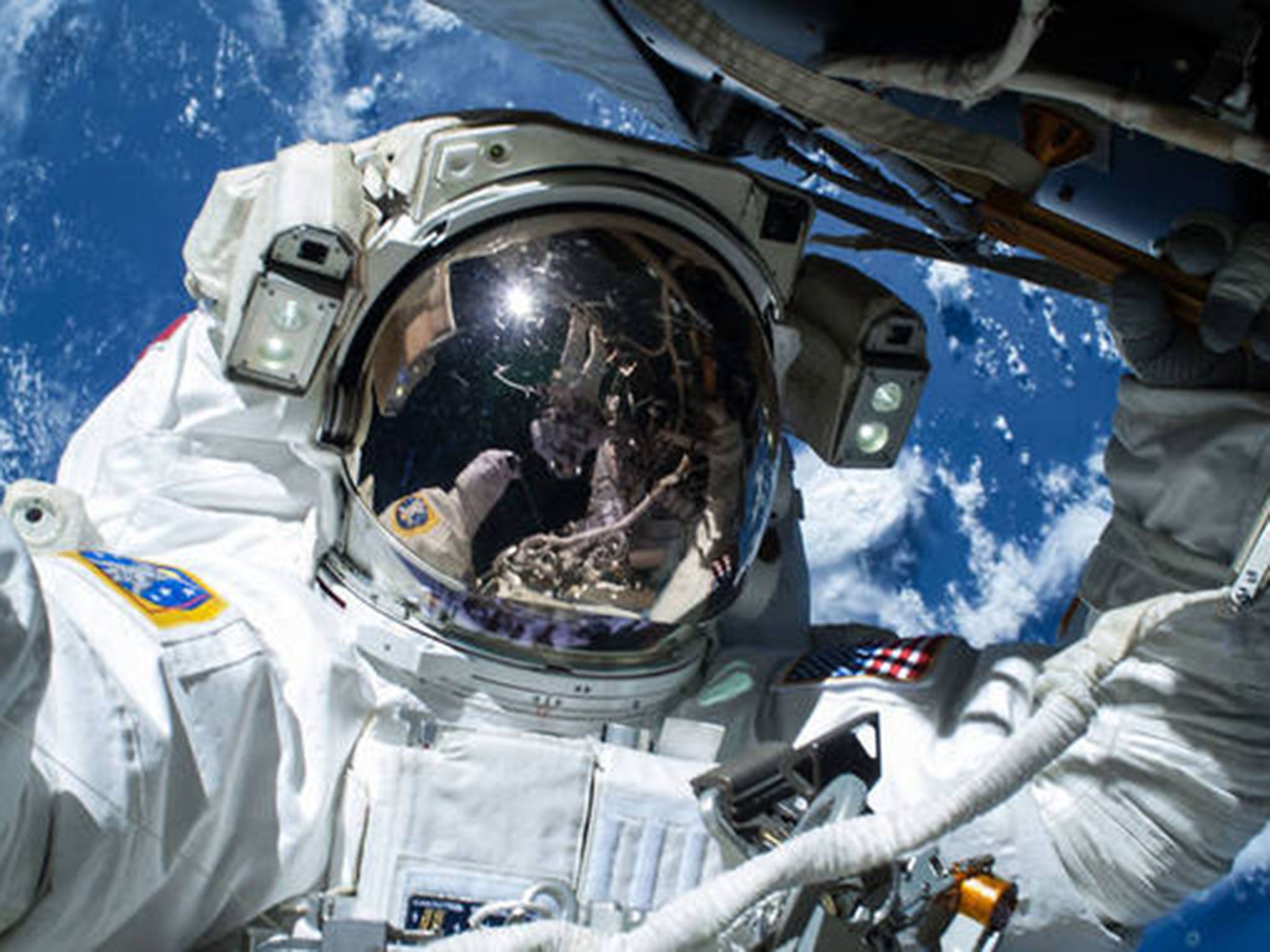 Wilmore taking a selfie of himself during his spacewalk on 21 February (Nasa)