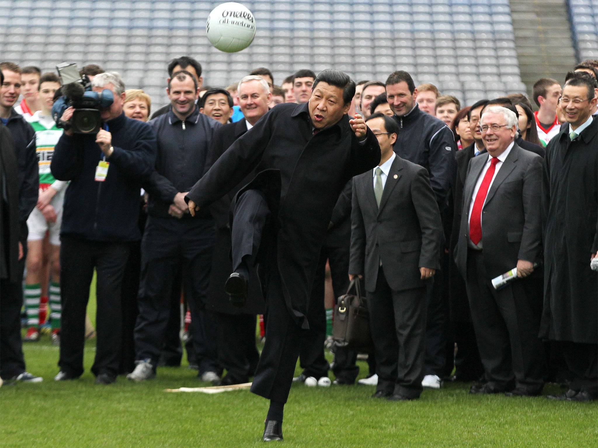 President Xi Jinping kicks a Gaelic football at Dublin’s Croke Park in 2012