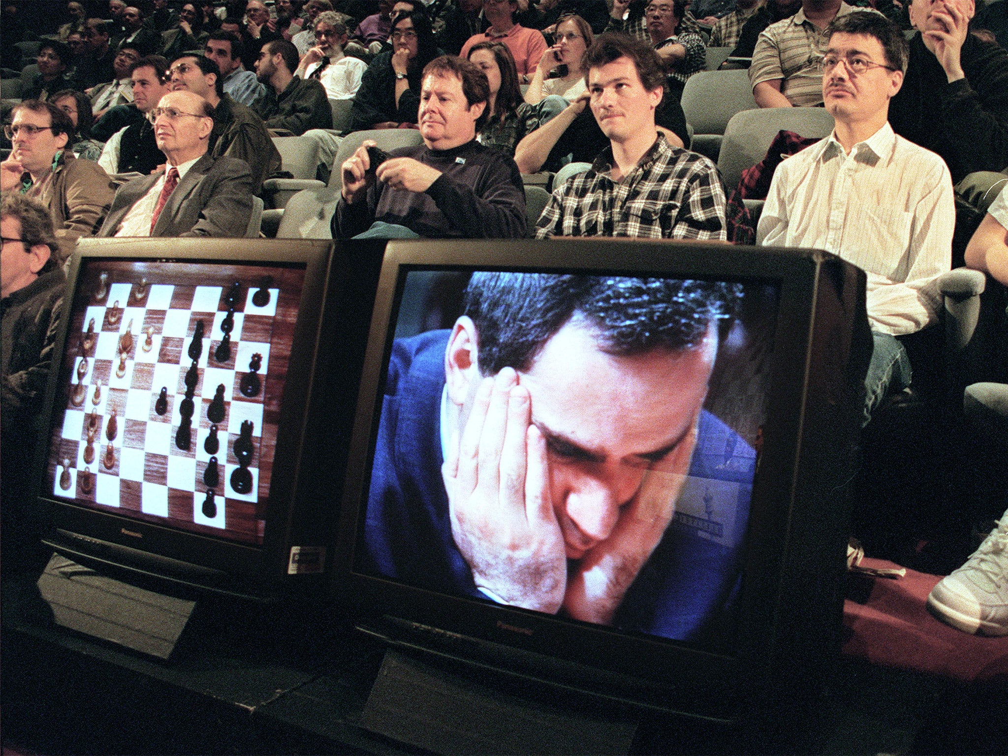 Chess enthusiasts watch as Deep Blue beats World Champion Garry Kasparov in 1997 (Getty)