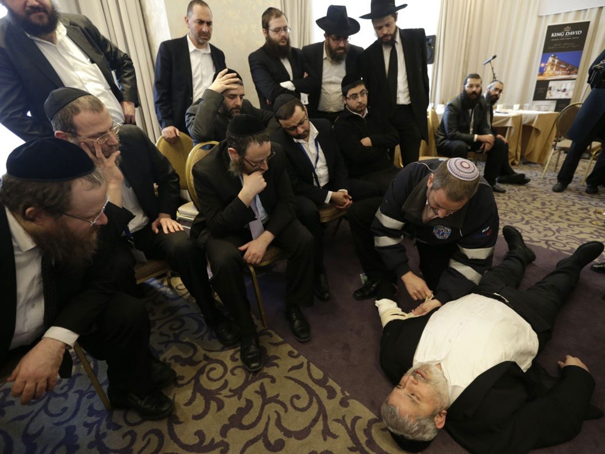 Rabbis take part in a first aid training during the Conference of European Rabbis in Prague, Czech Republic, Tuesday, Feb. 24, 2015. Due to the recent attacks on Jewish communities in Europe, part of the conference was a self defense and first aid trainin