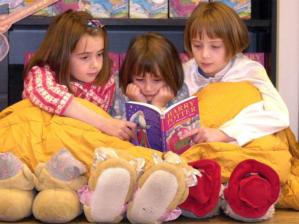 Youngsters reading 'Harry Potter'