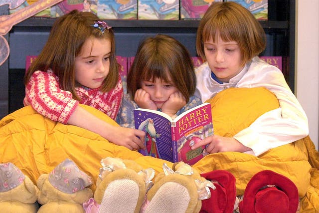 Youngsters reading 'Harry Potter'
