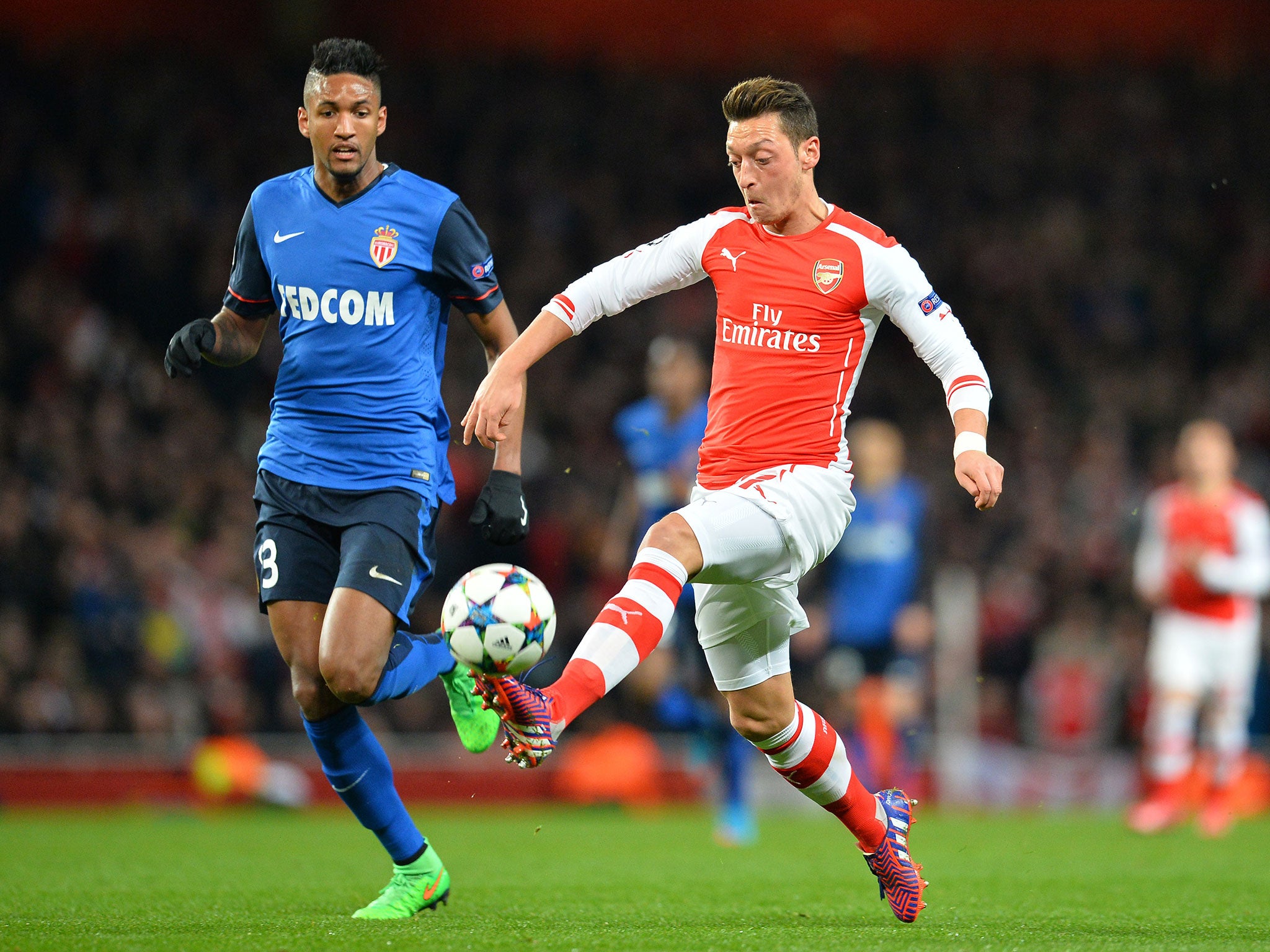 Wallace marks Mesut Özil (right), who lost possession too often playing moderate passes
