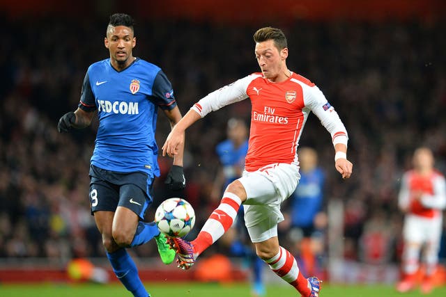 Wallace marks Mesut Özil (right), who lost possession too often playing moderate passes 