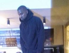 Kanye West mounts table at Nandos to cheers of 'Yeezus' before Brits