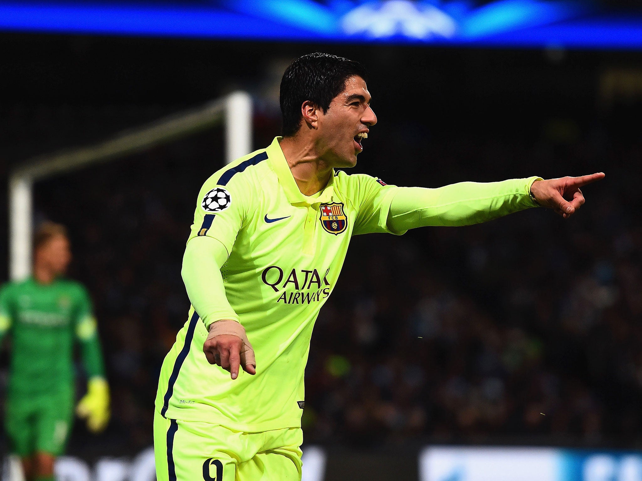 Barcelona forward Luis Suarez celebrates scoring against Manchester City