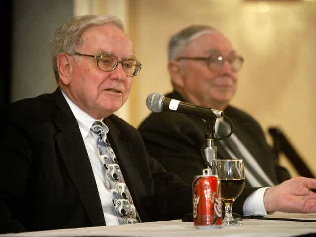 Warren Buffett with a trusty can of Coca-Cola