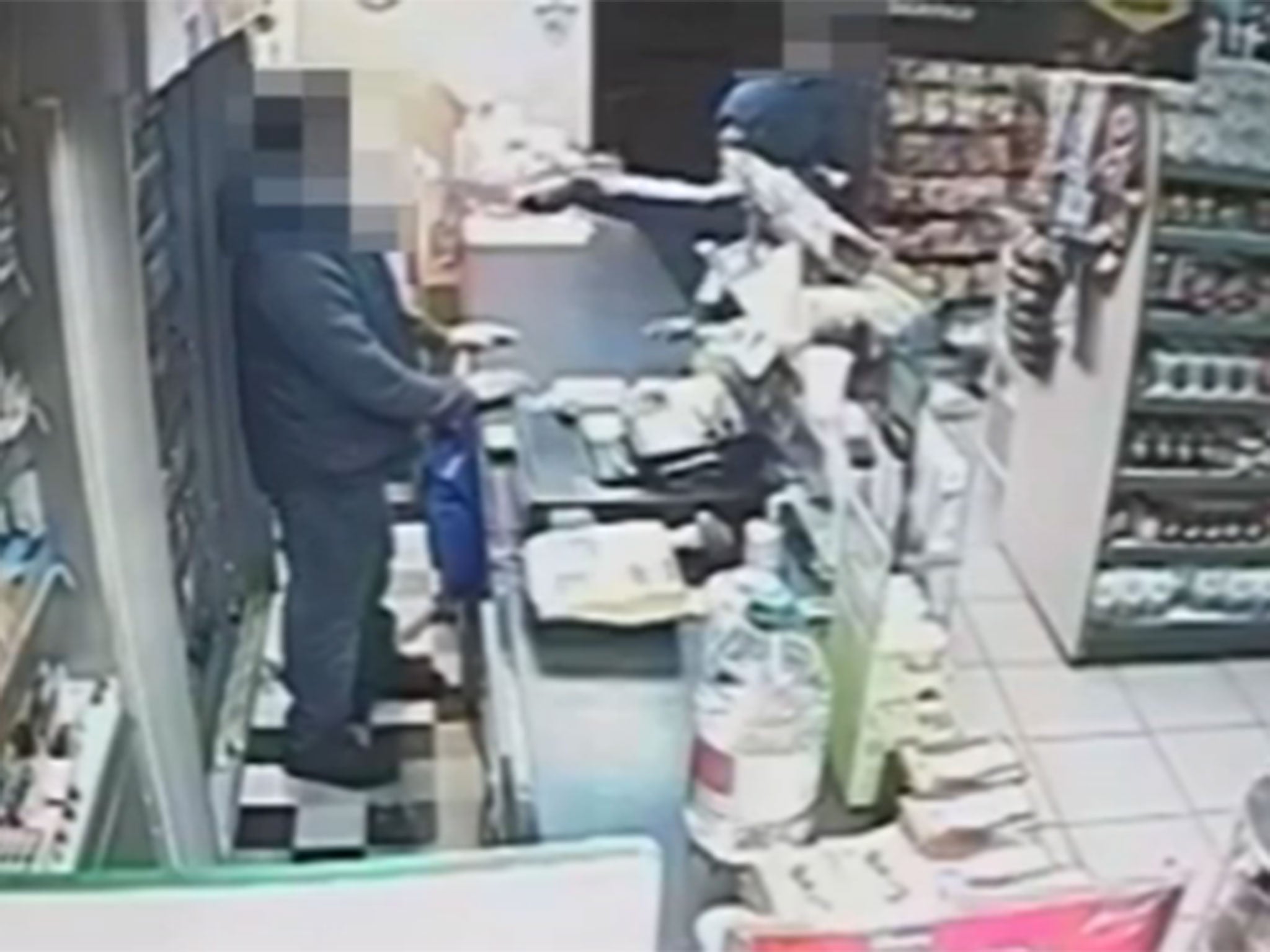The shop worker was caught by the knife as he opened the till