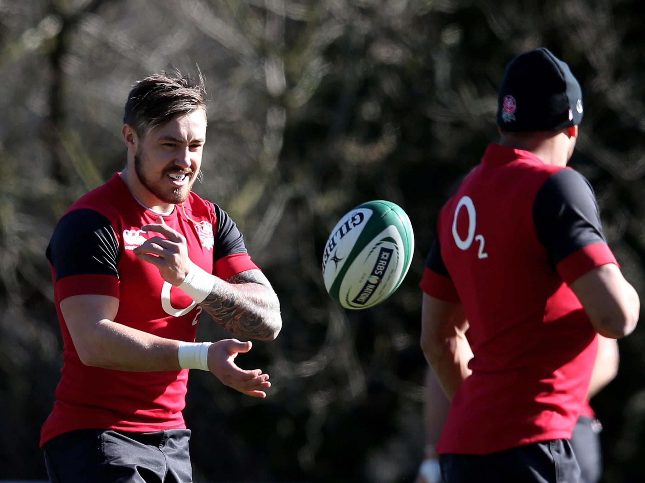 Wing Jack Nowell passes to teammate centre Jonathan Joseph of England during the England Training session on Friday