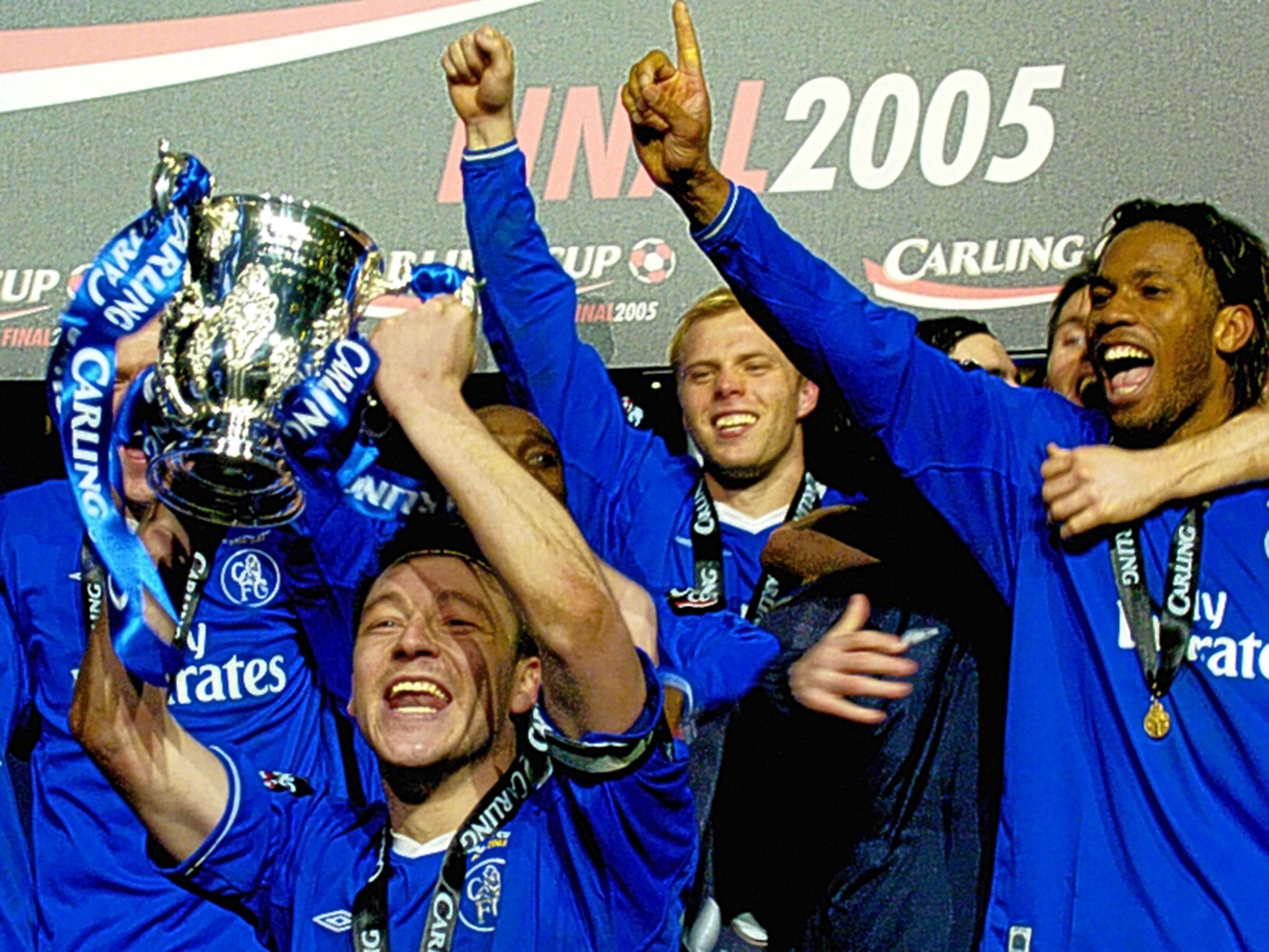 John Terry, holding trophy, celebrates with Chelsea team-mates after winning the League Cup in 2005
