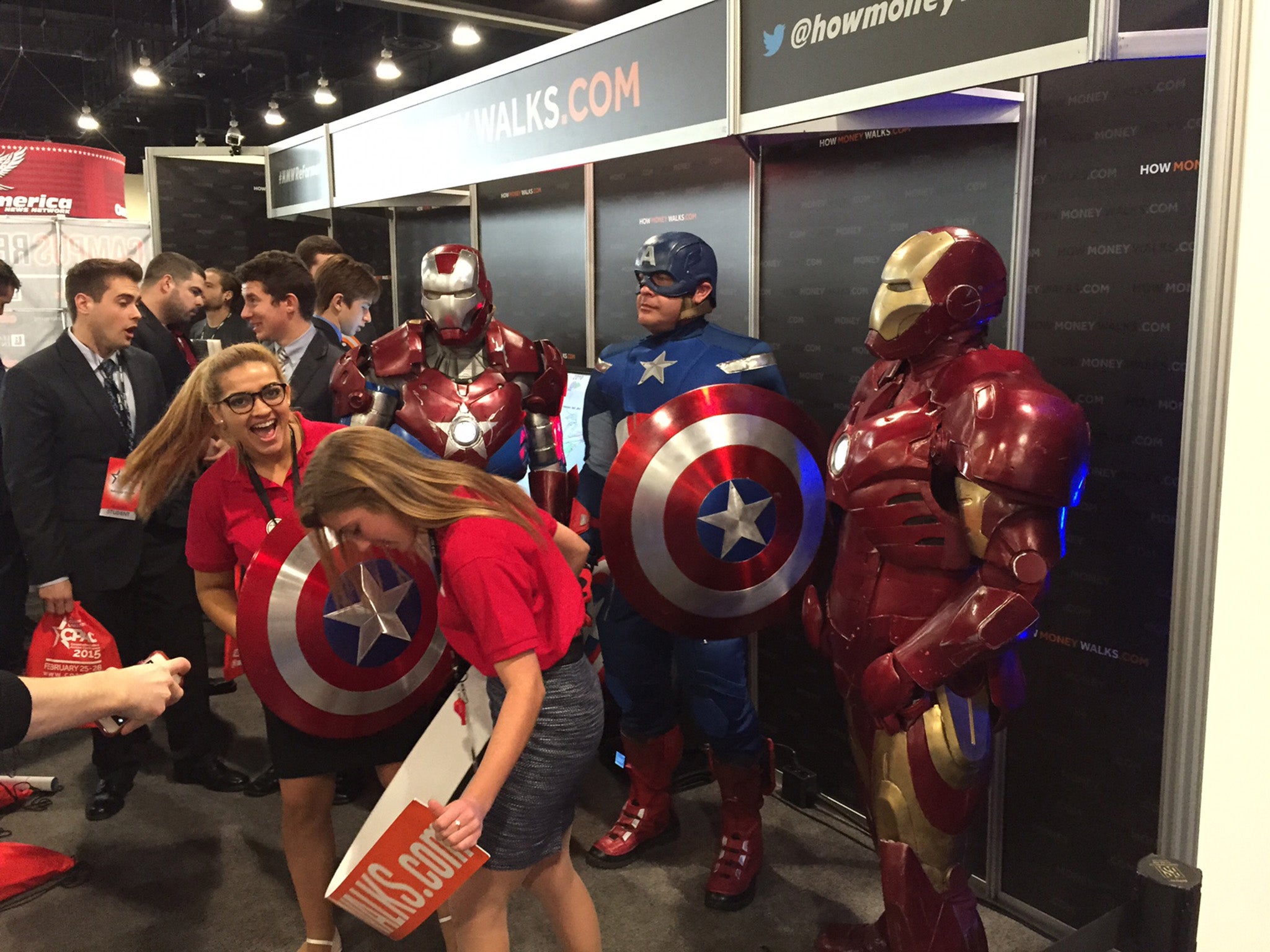 Convention-goers pose with Iron Man and Captain America in one of the ballrooms at CPAC 2015.