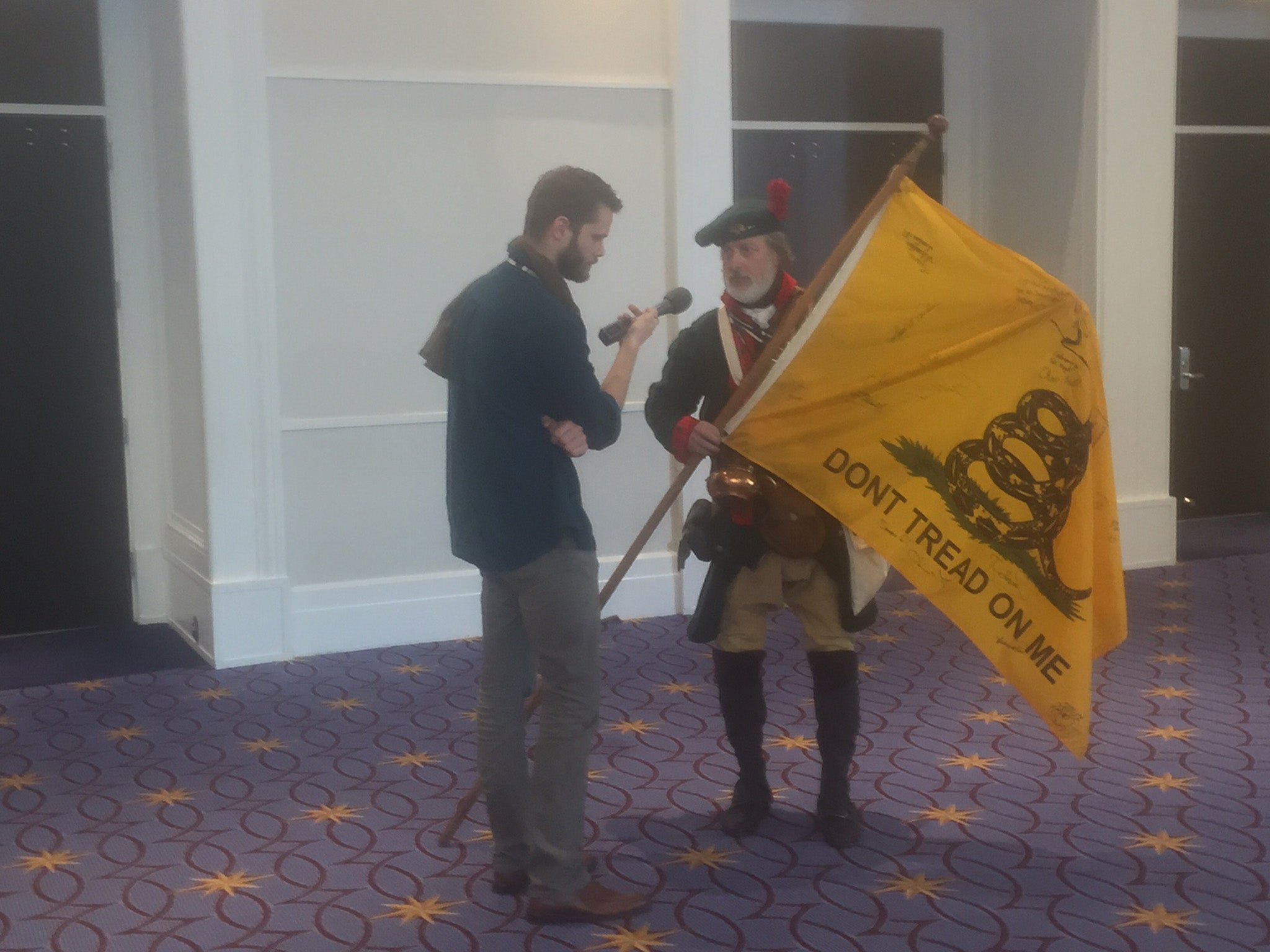 Here is a conference-goer with his Gadsden flag, a common symbol of the Tea Party.