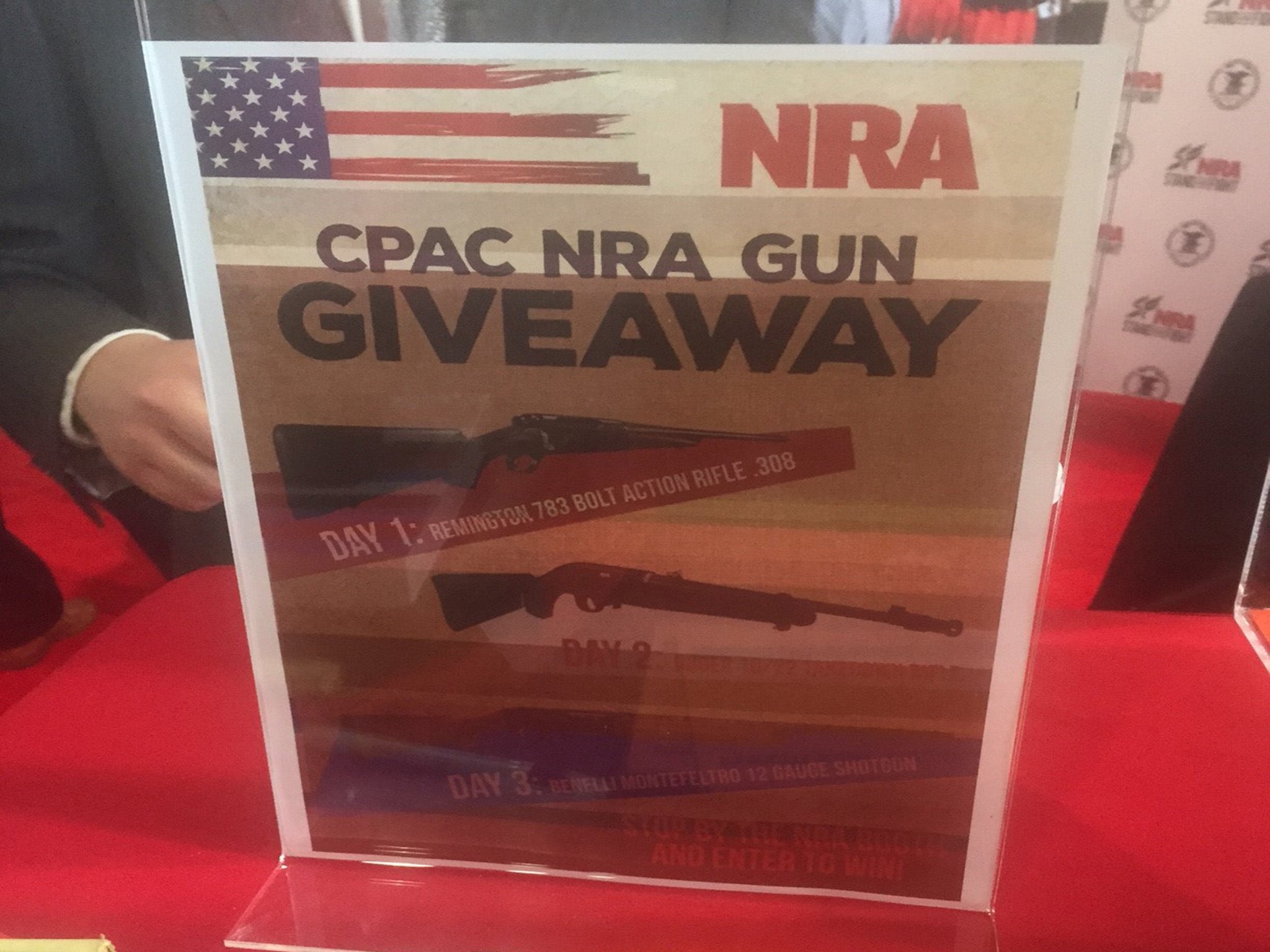 This flier at the National Rifle Association booth advertises a gun raffle. Three days in a row, the NRA raffled off firearms.