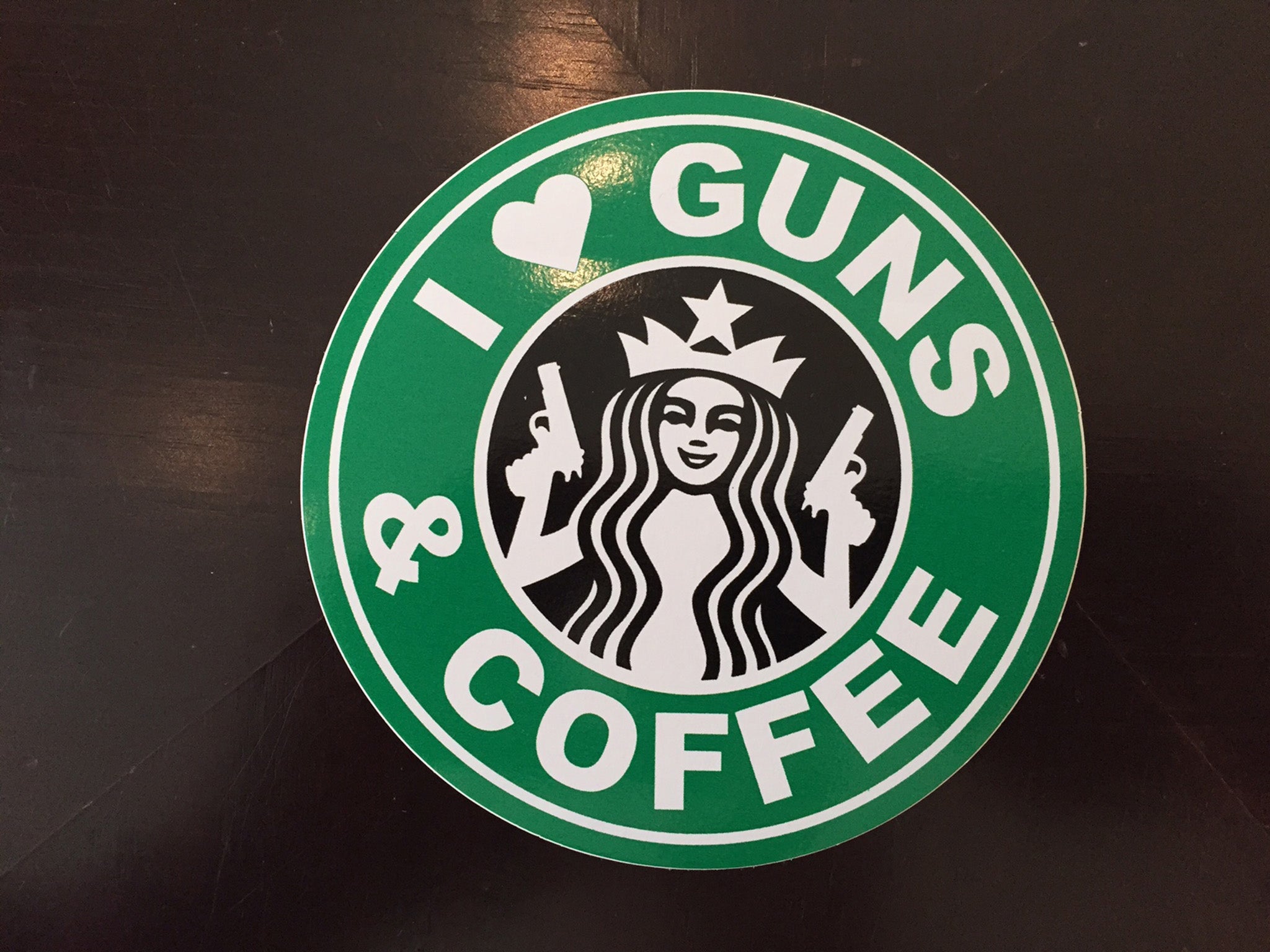 Another booth was giving a pro-gun stickers. There was also a t-shirt with this image -- a play on the Starbucks logo.