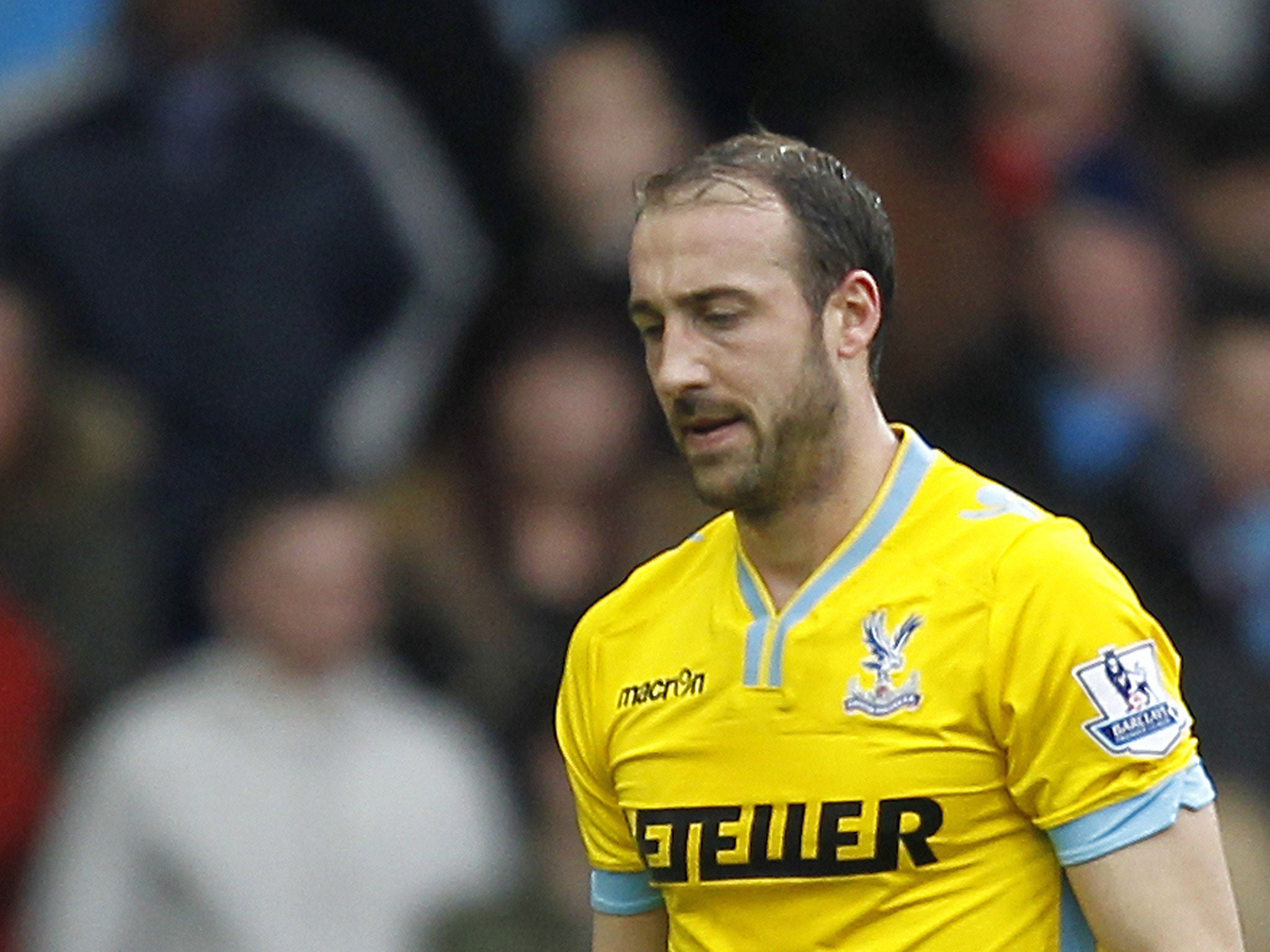 Glenn Murray walks off the pitch after being shown a red card