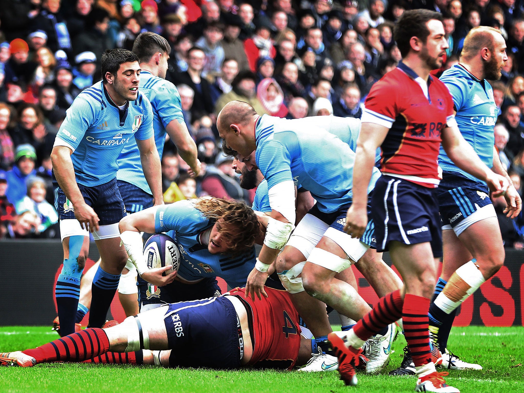 Josh Furno emerges with the ball after scoring a try for Italy