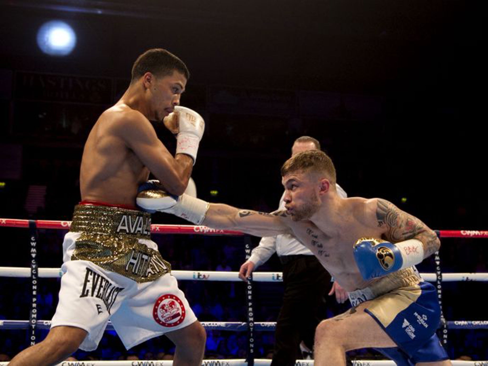 Carl Frampton in action against Chris Avalos at the Odyssey Arena, Belfast; Frampton retained his IBF super-bantamweight title with a fifth-round stoppage of his opponent