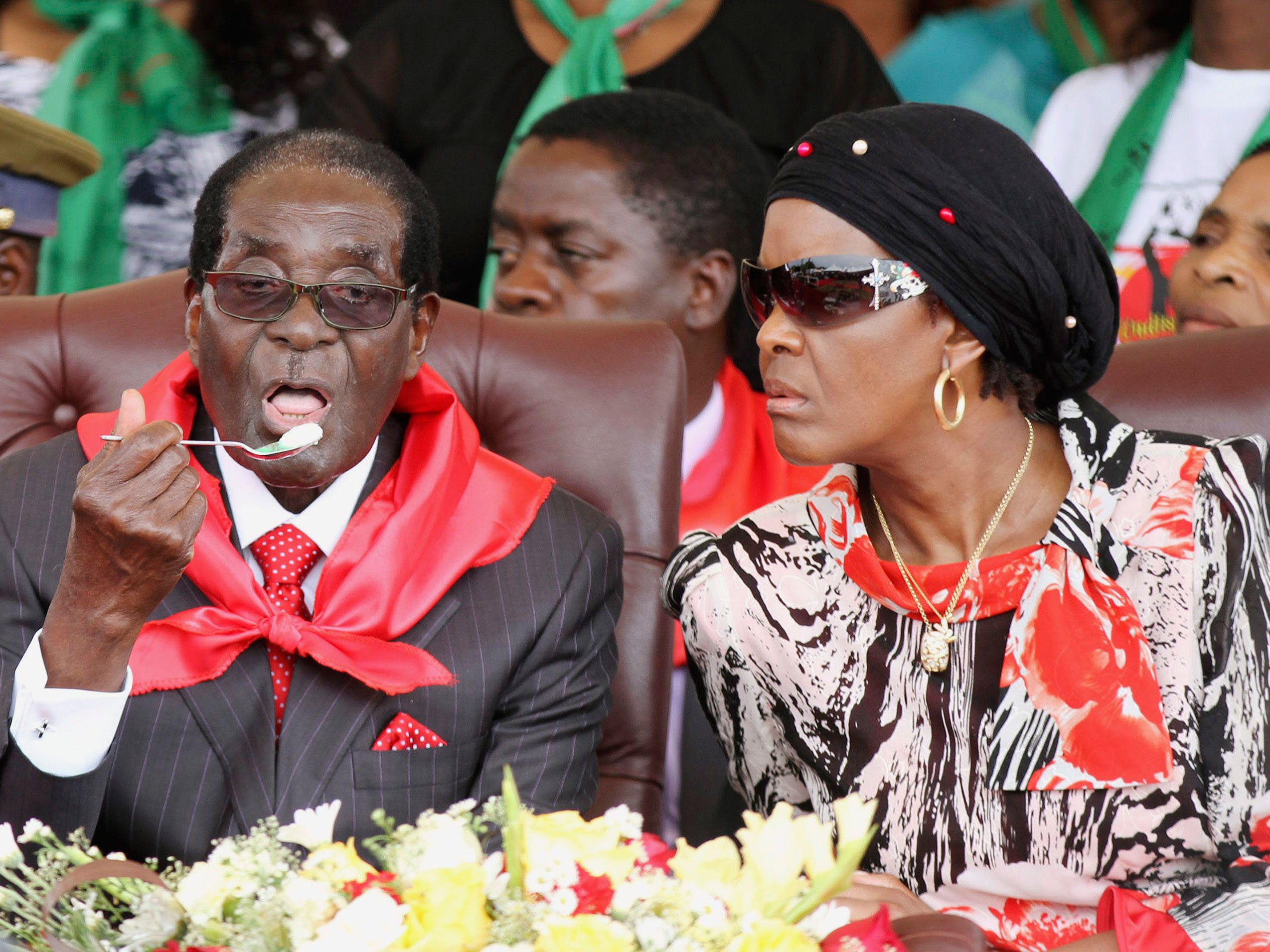 Zimbabwean President Robert Mugabe eats his birthday cake at the Elephant Hills Hotel in Victoria Falls, Zimbabwe, 28 February 2015