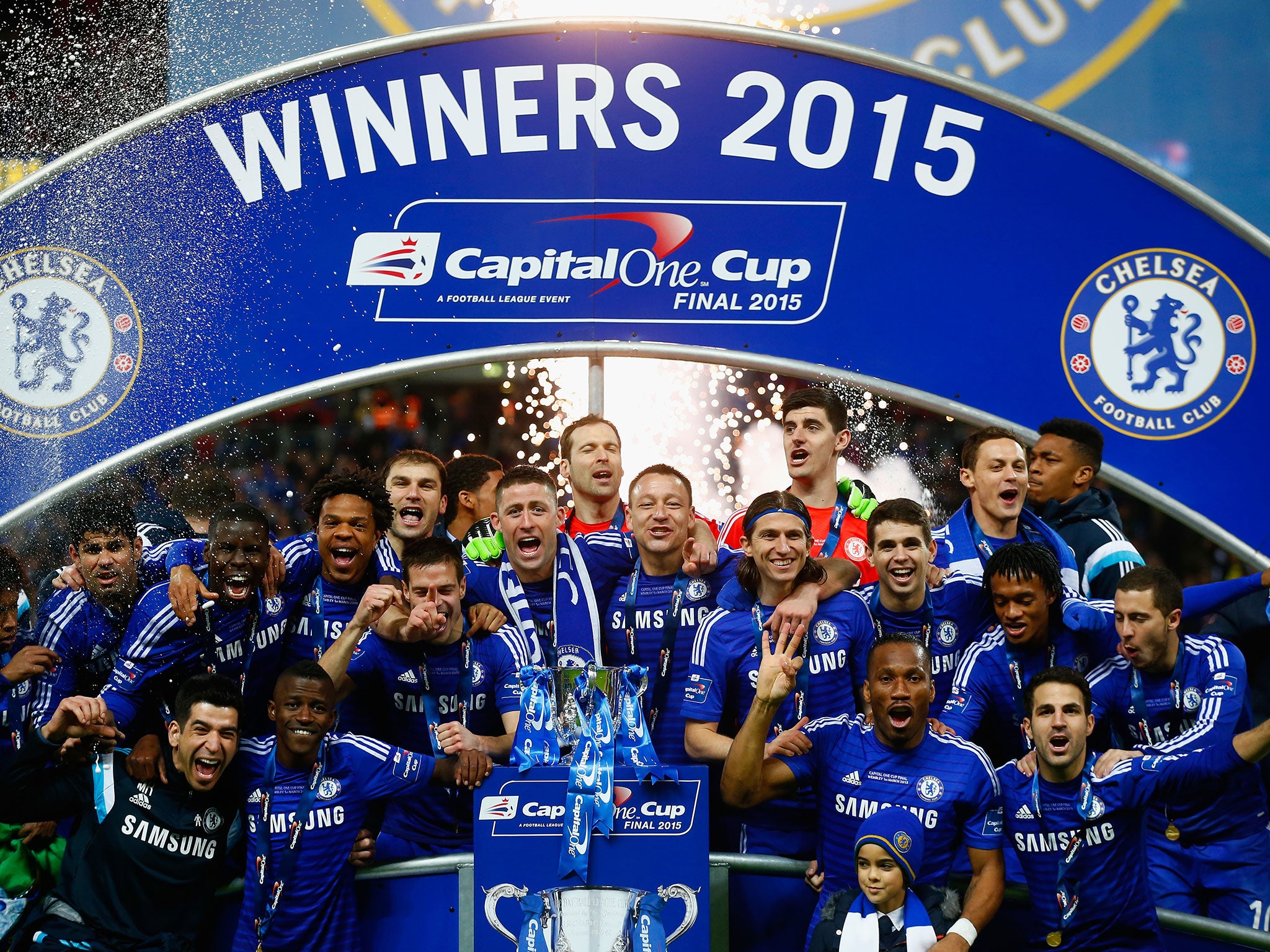 Chelsea players celebrate with the trophy