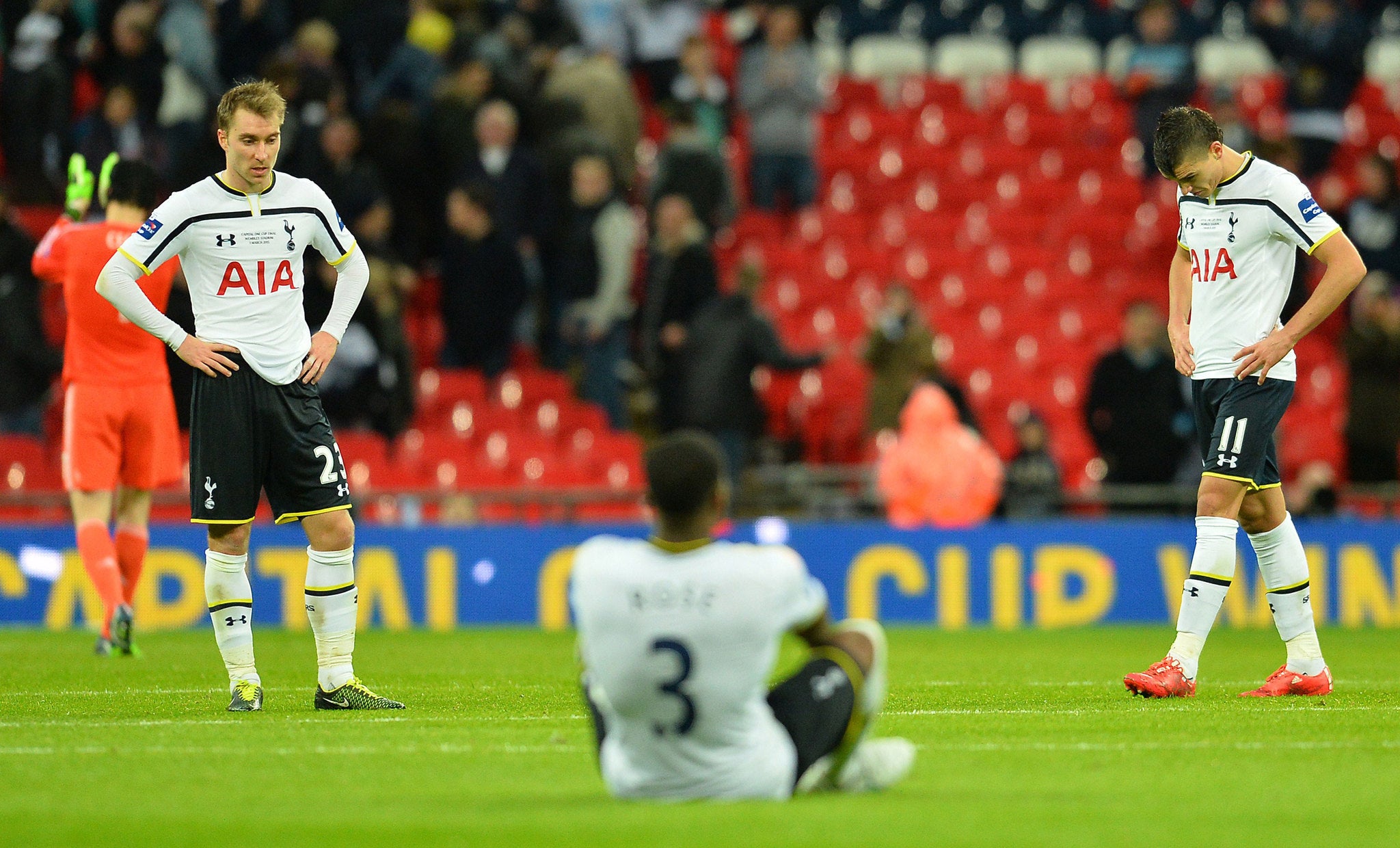 Tottenham's players despondent and dejected at the final whistle after losing to bitter rivals Chelsea at Wembley
