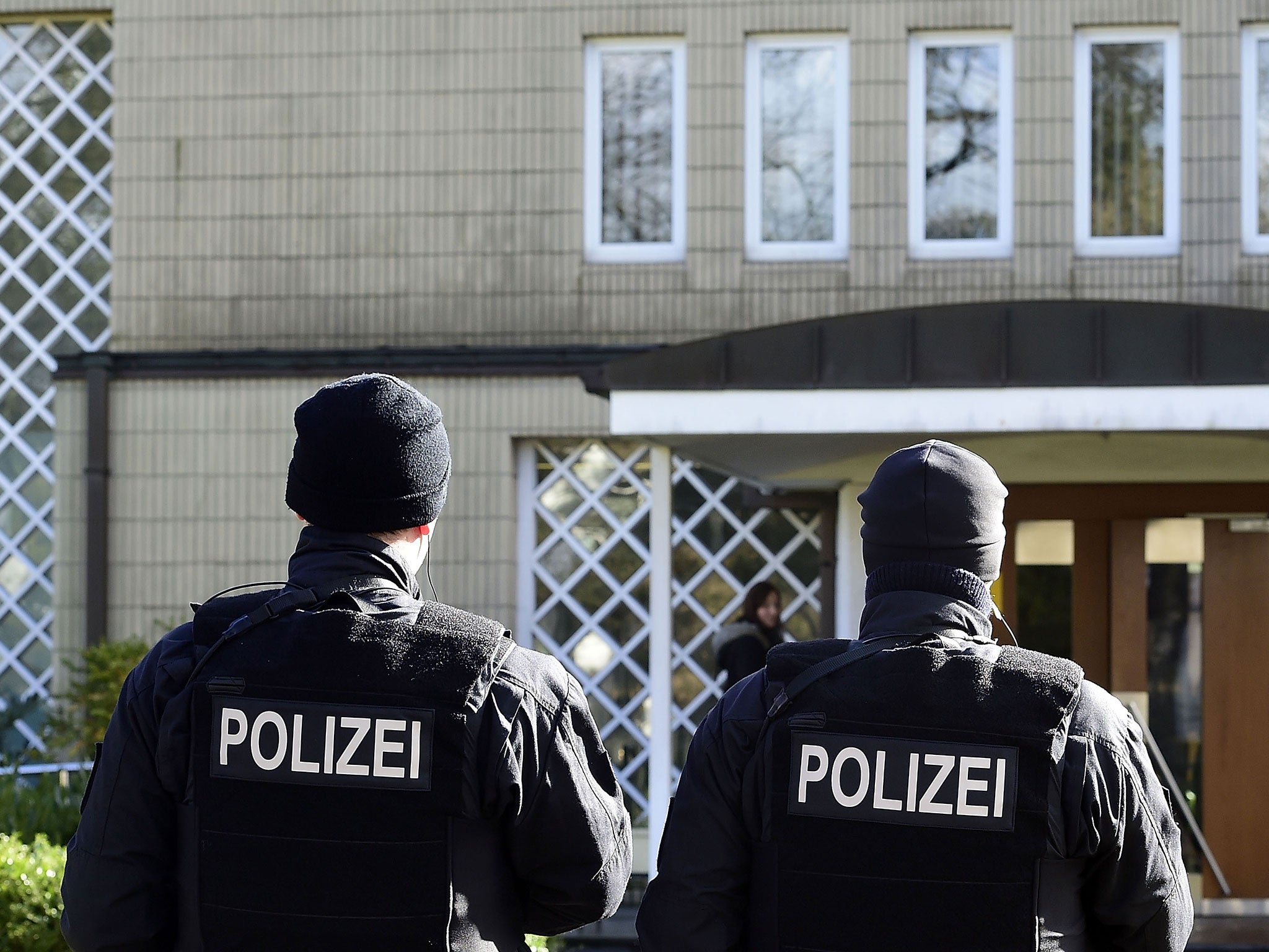 Police officers stand guard outside a synagogue in Bremen, Germany. Bremen is on high alert after authorities reported that they had concrete information about a possible terror threat