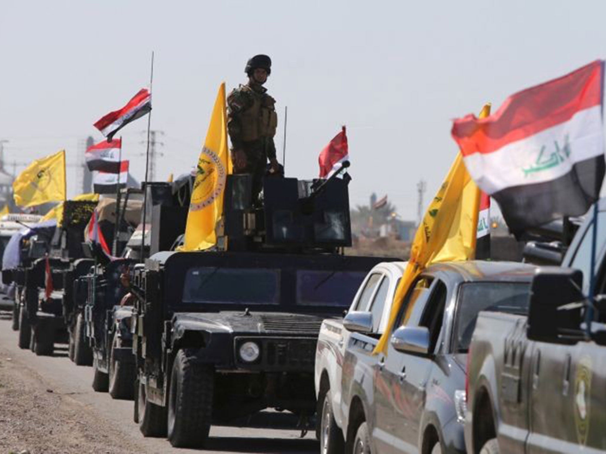 Iraqi soldiers heading from the city of Samarra north of Baghdad drive towards Tikrit to launch an assault against Isis on February 28, 2015.