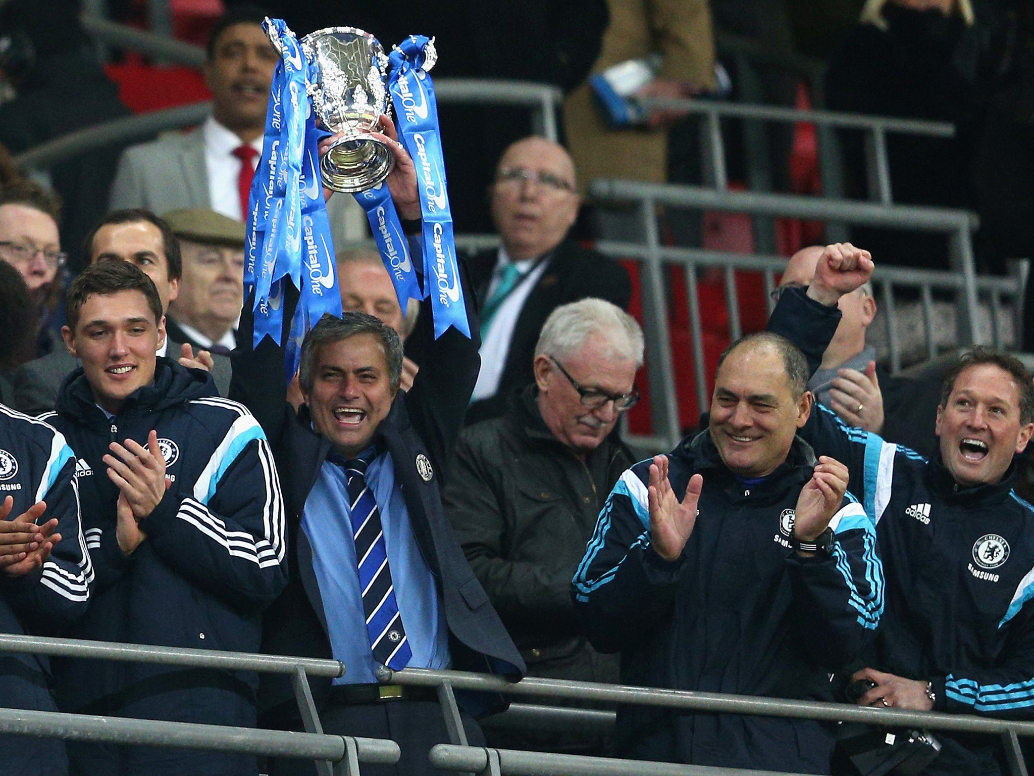 Mourinho lifting the trophy on Sunday