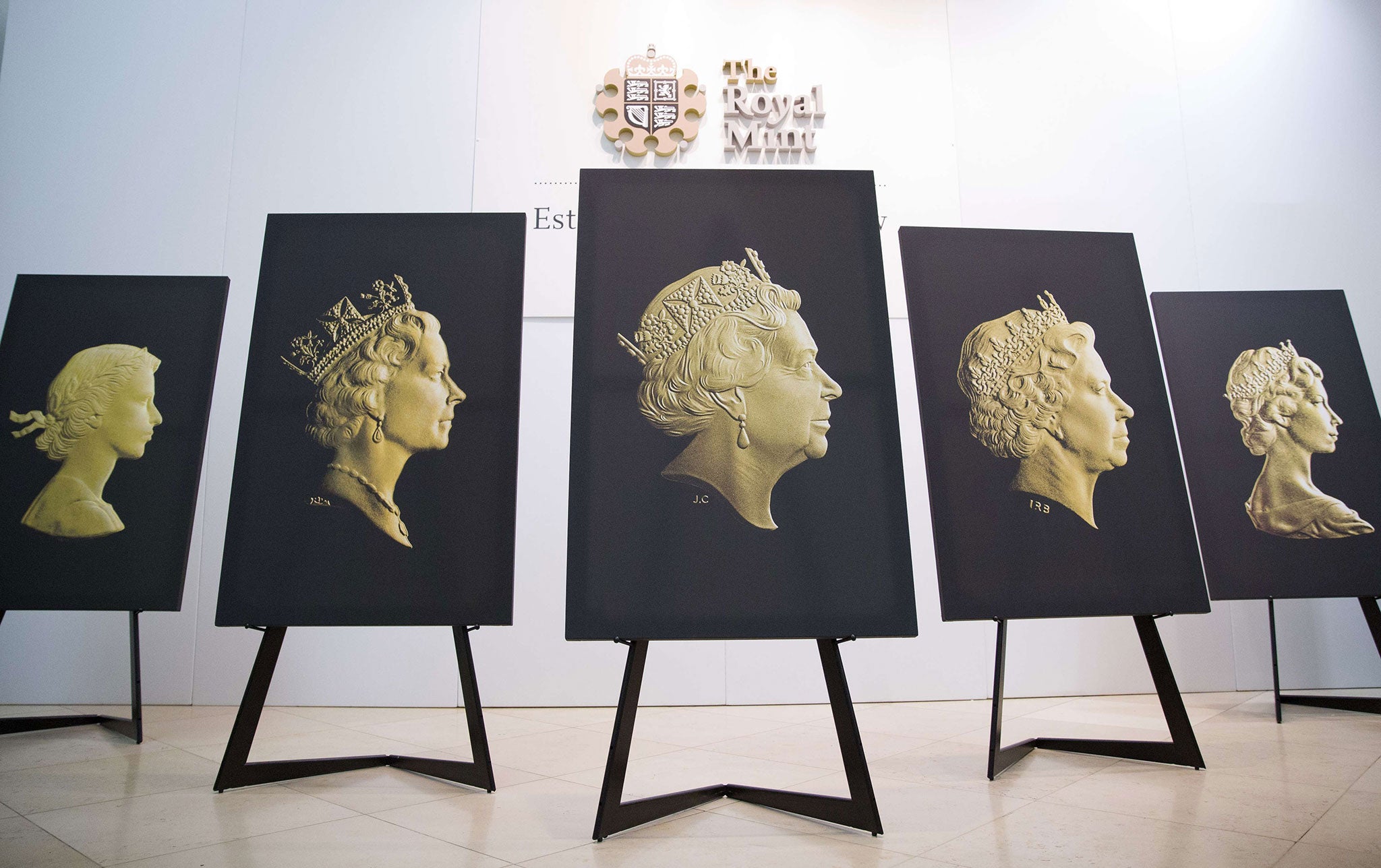 The five definitive coin portraits, (L-R) The Mary Gillick portrait 1953, The Raphael Maklouf portrait 1985, The new Jody Clark portrait, The Ian Rank-Broadley portrait 1968 and The Arnold Machin portrait are displayed at the National Portrait Gallery in London