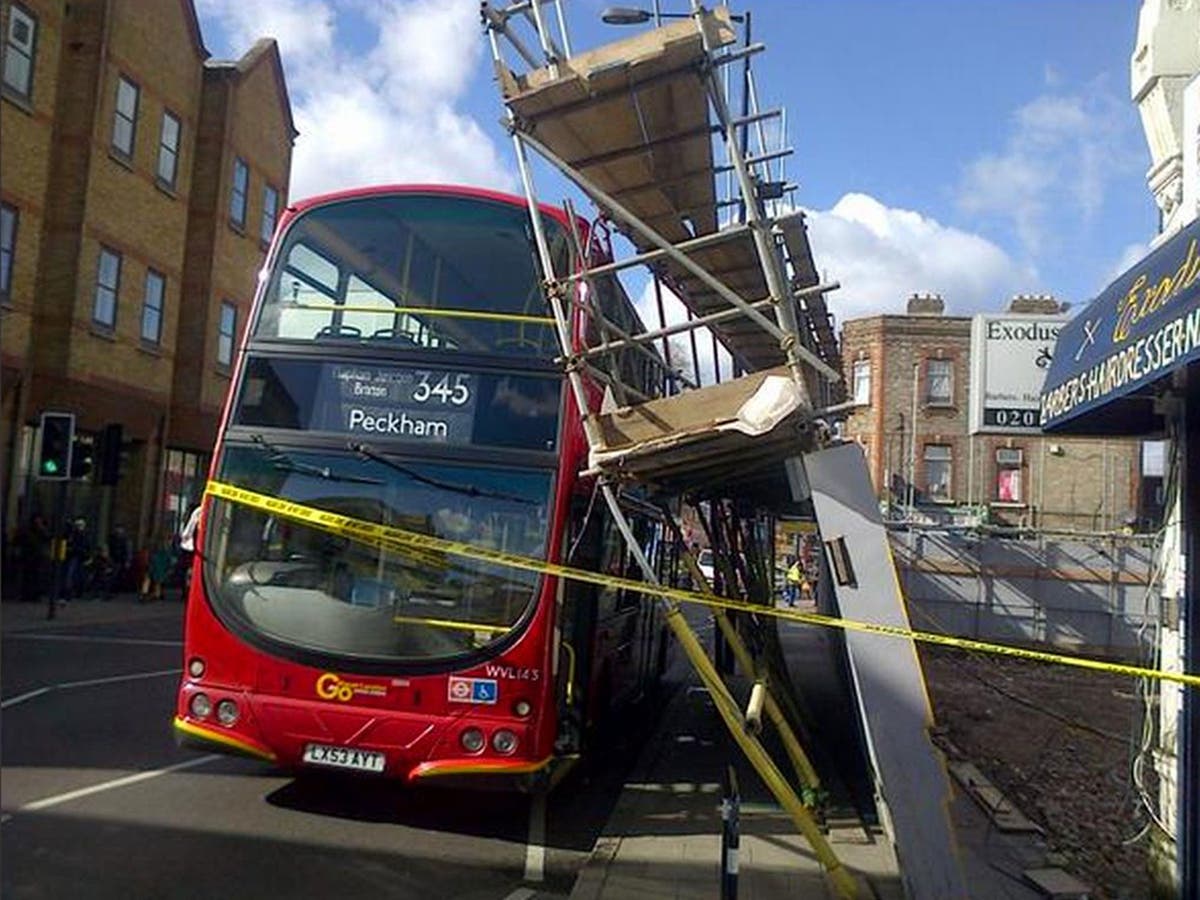 Scaffolding collapses on double decker bus in busy London high street ...