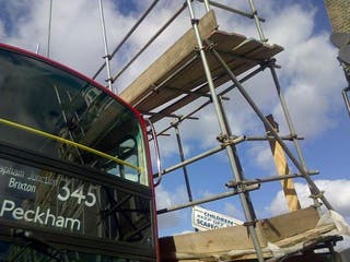 Scaffolding collapses on double decker bus in busy London high street ...