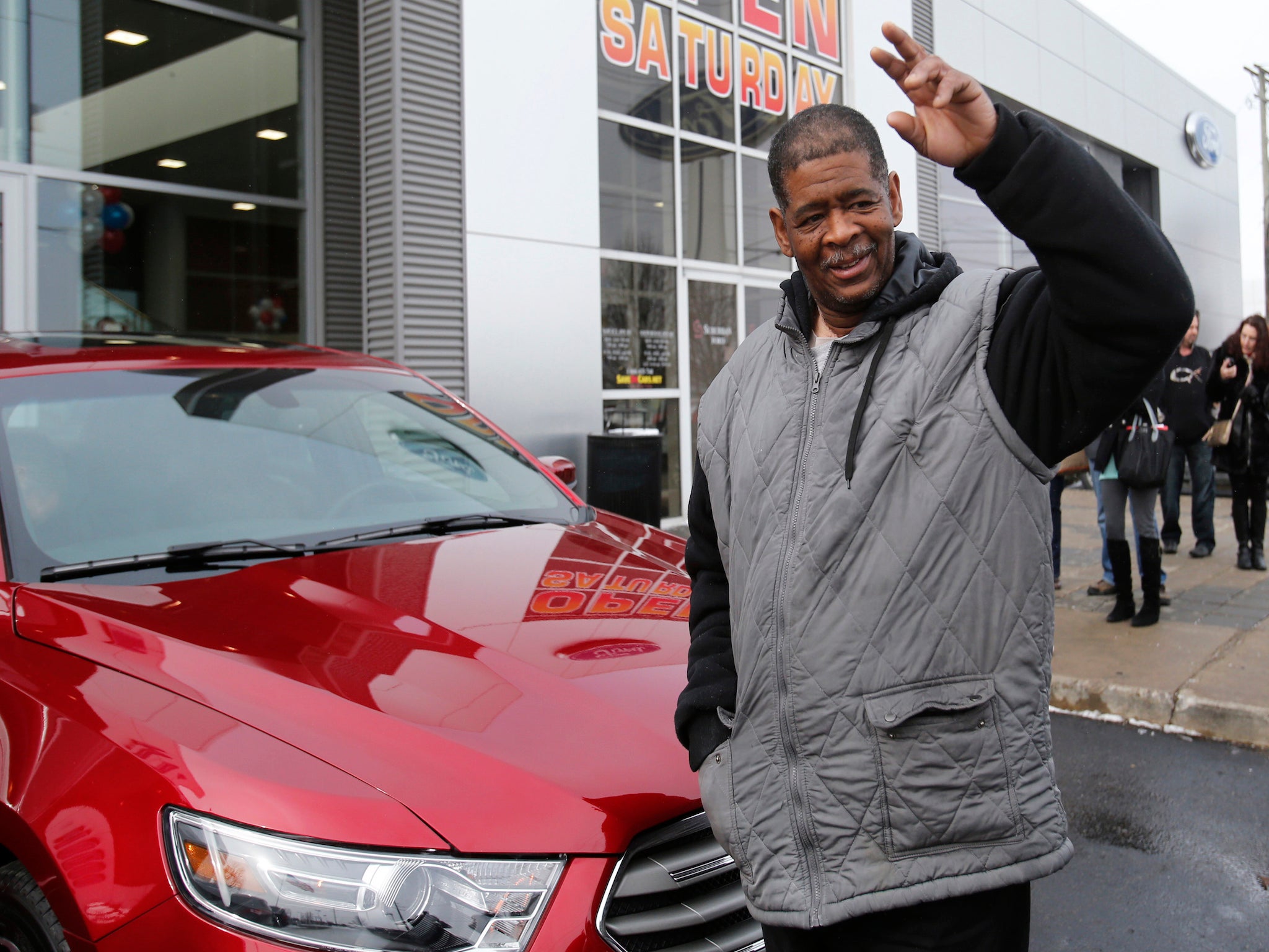 James Robertson, who walked 21 miles to his job in Detroit, bought a car with donations from the public