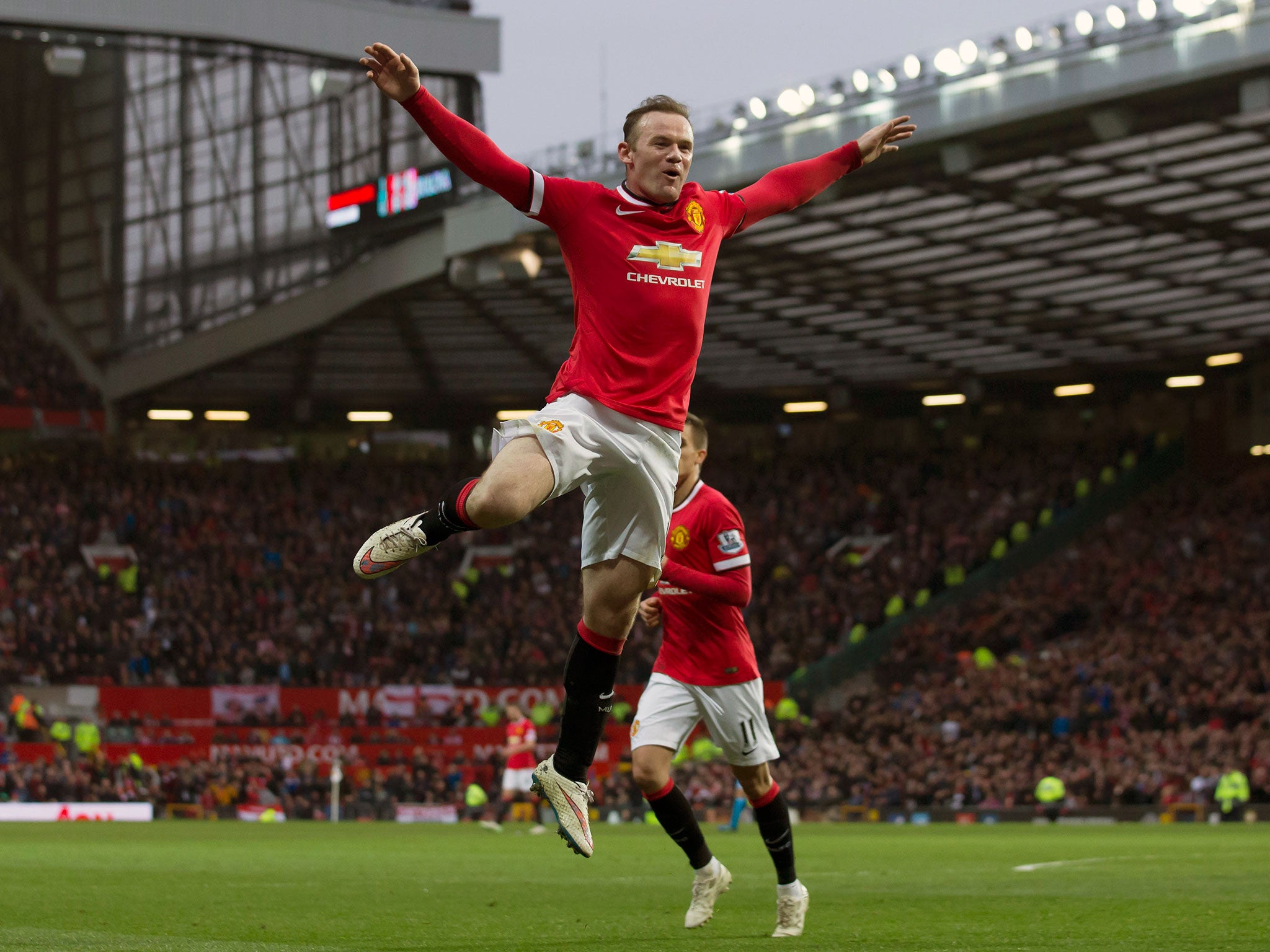 Manchester United's Wayne Rooney, centre, celebrates after scoring his second goal during the English Premier League soccer match between Manchester United and Sunderland at Old Trafford Stadium, Manchester