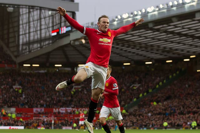 Manchester United's Wayne Rooney, centre, celebrates after scoring his second goal during the English Premier League soccer match between Manchester United and Sunderland at Old Trafford Stadium, Manchester 