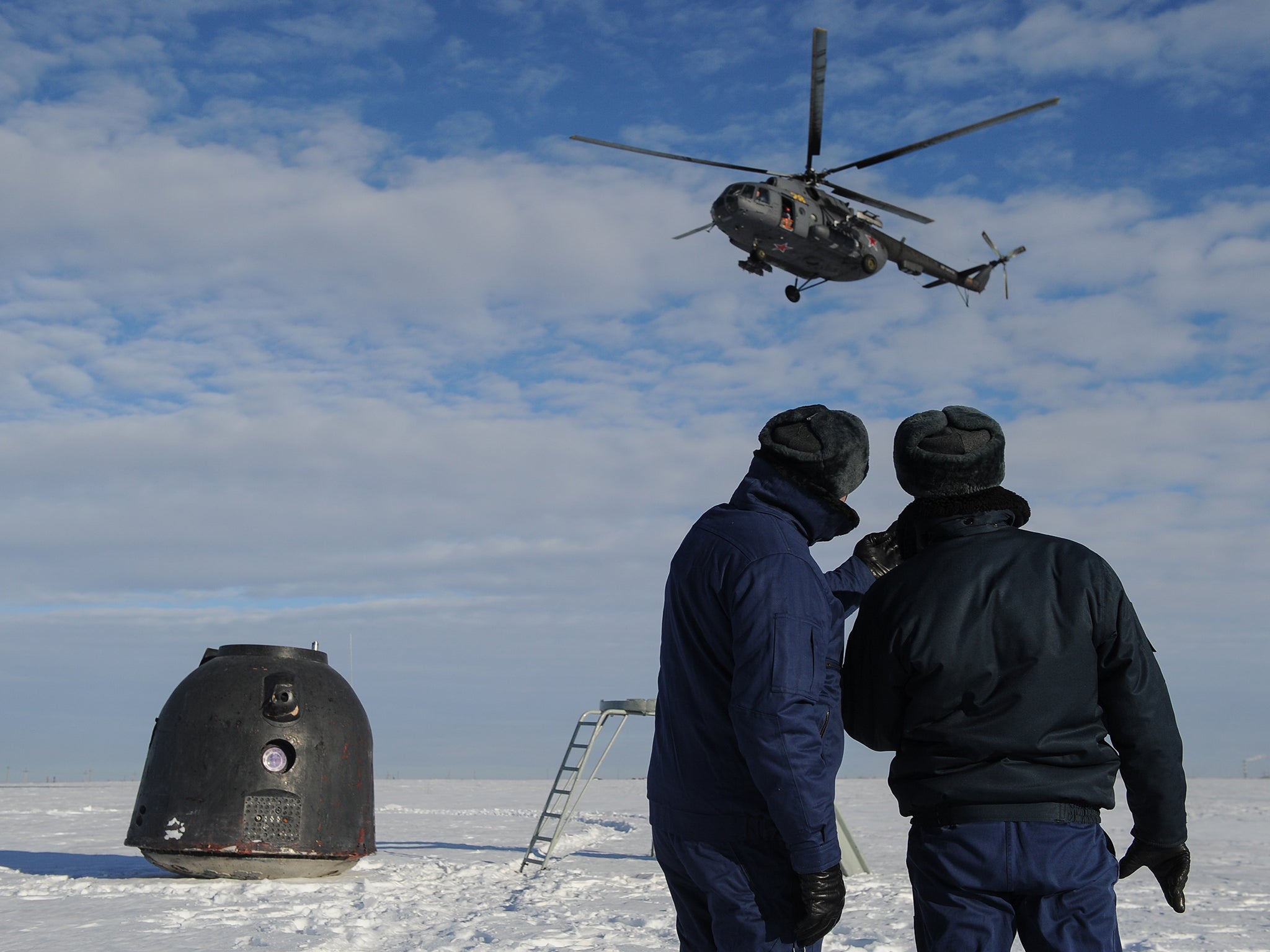 Soldiers seen during exercises on search, rescue and evacuation of a Soyuz TMA spacecraft; the exercises are conducted by air forces of Russia's Central Military District