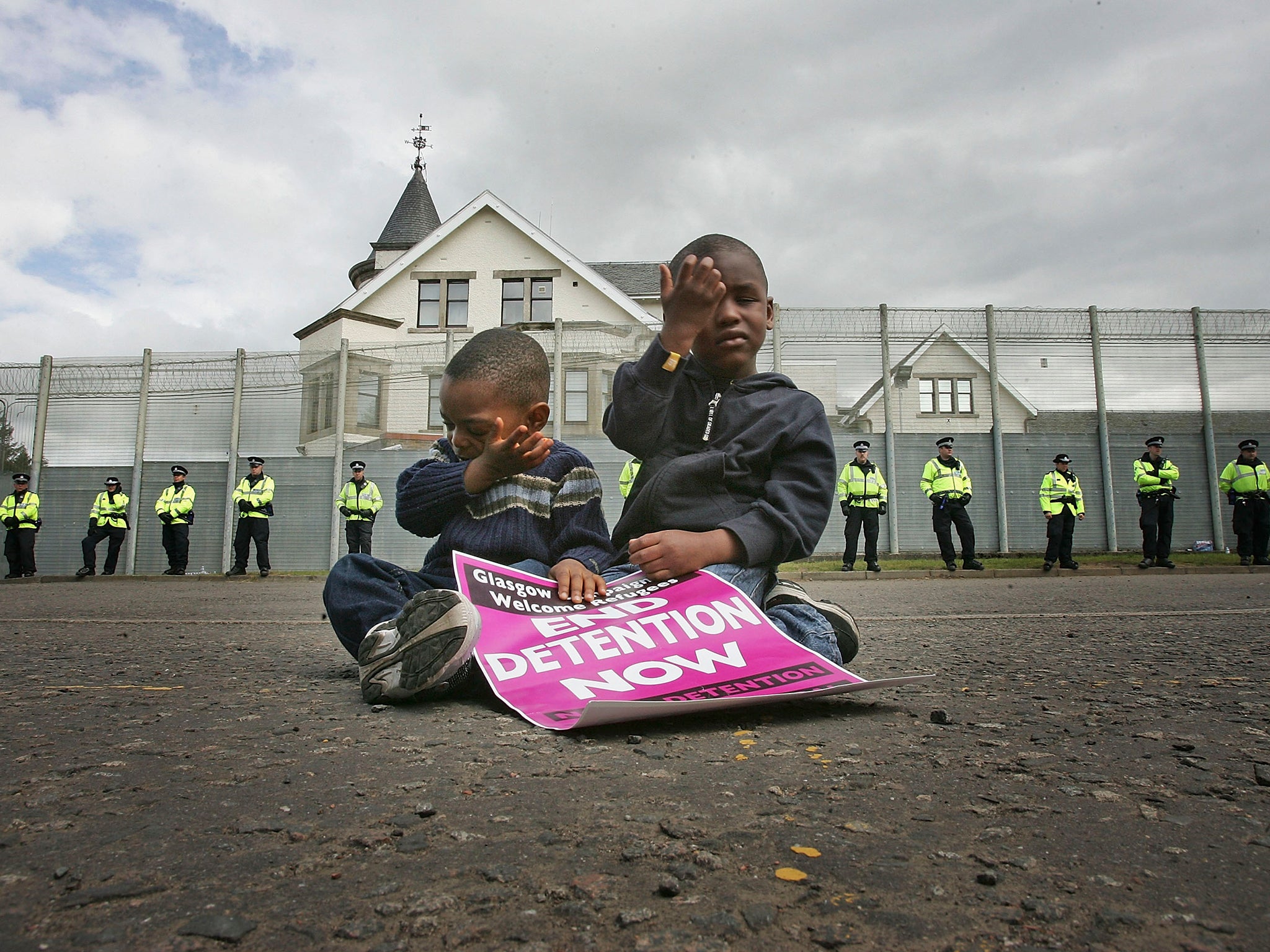 Three-year-old Ahmad Ilunga, left, and his brother Jay, four, join protesters from G8 Alternatives outside Dungavel Dentention Centre in 2005