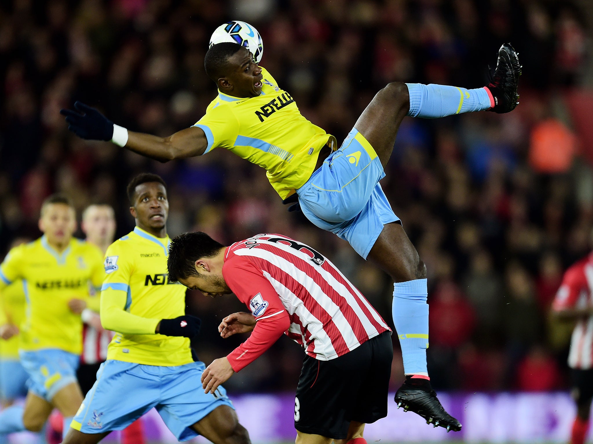 Yannick Bolasie of Crystal Palace and Maya Yoshida of Southampton compete for the ball