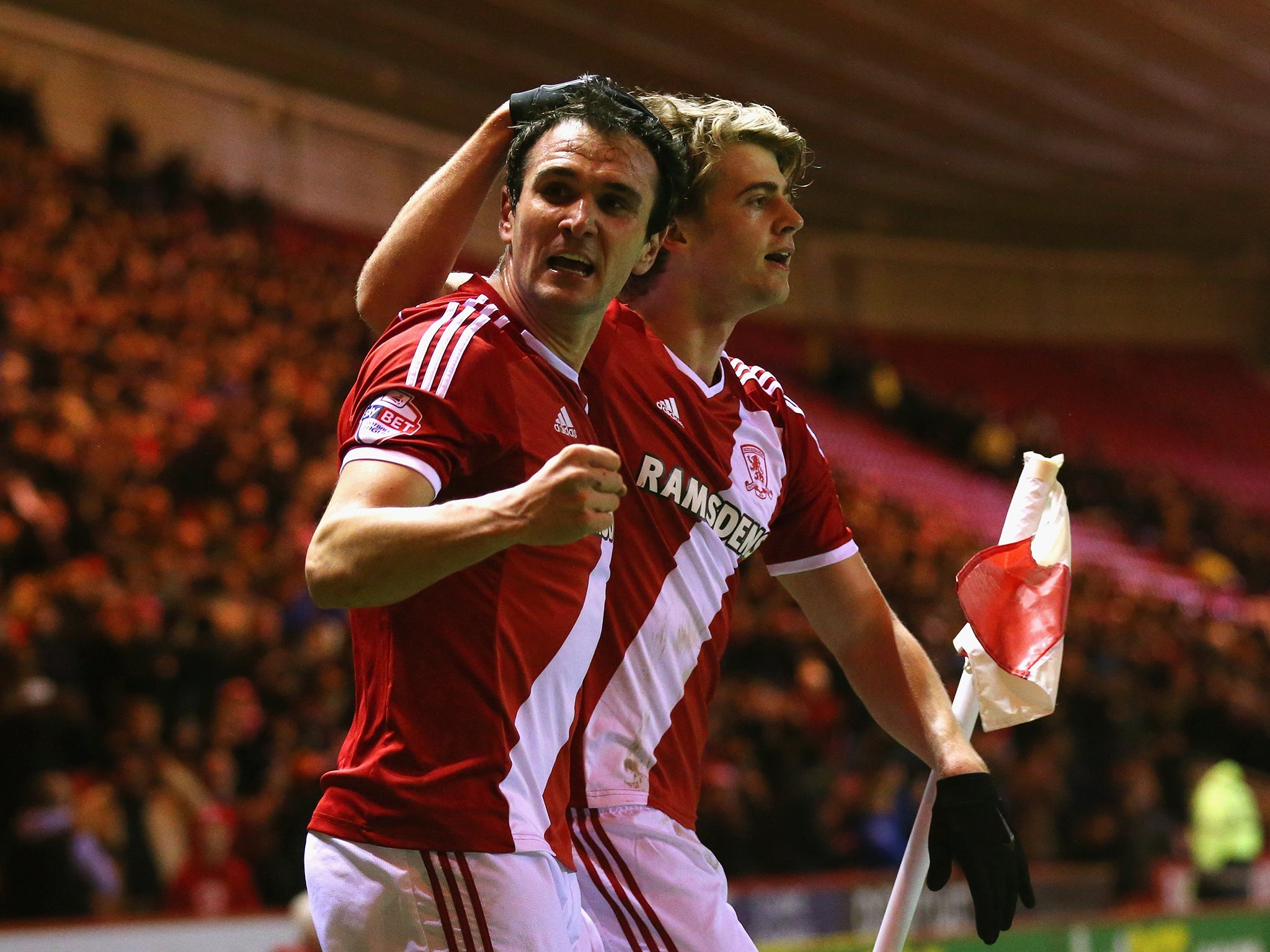 Patrick Bamford of Middlesbrough celebrates scoring the opening goal with Enrique Garcia