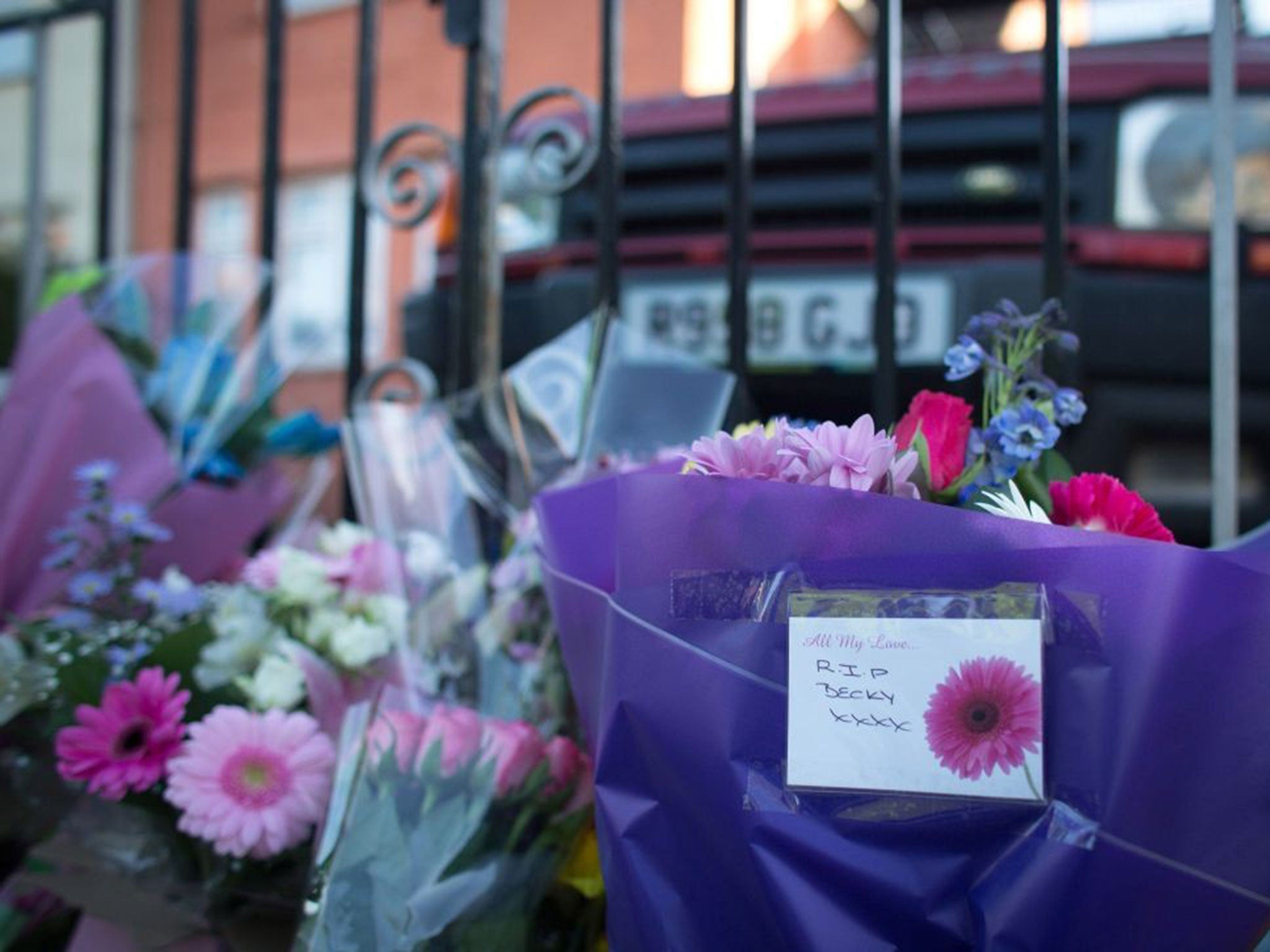 Flowers are left outside Becky Watts' family home on 3 March