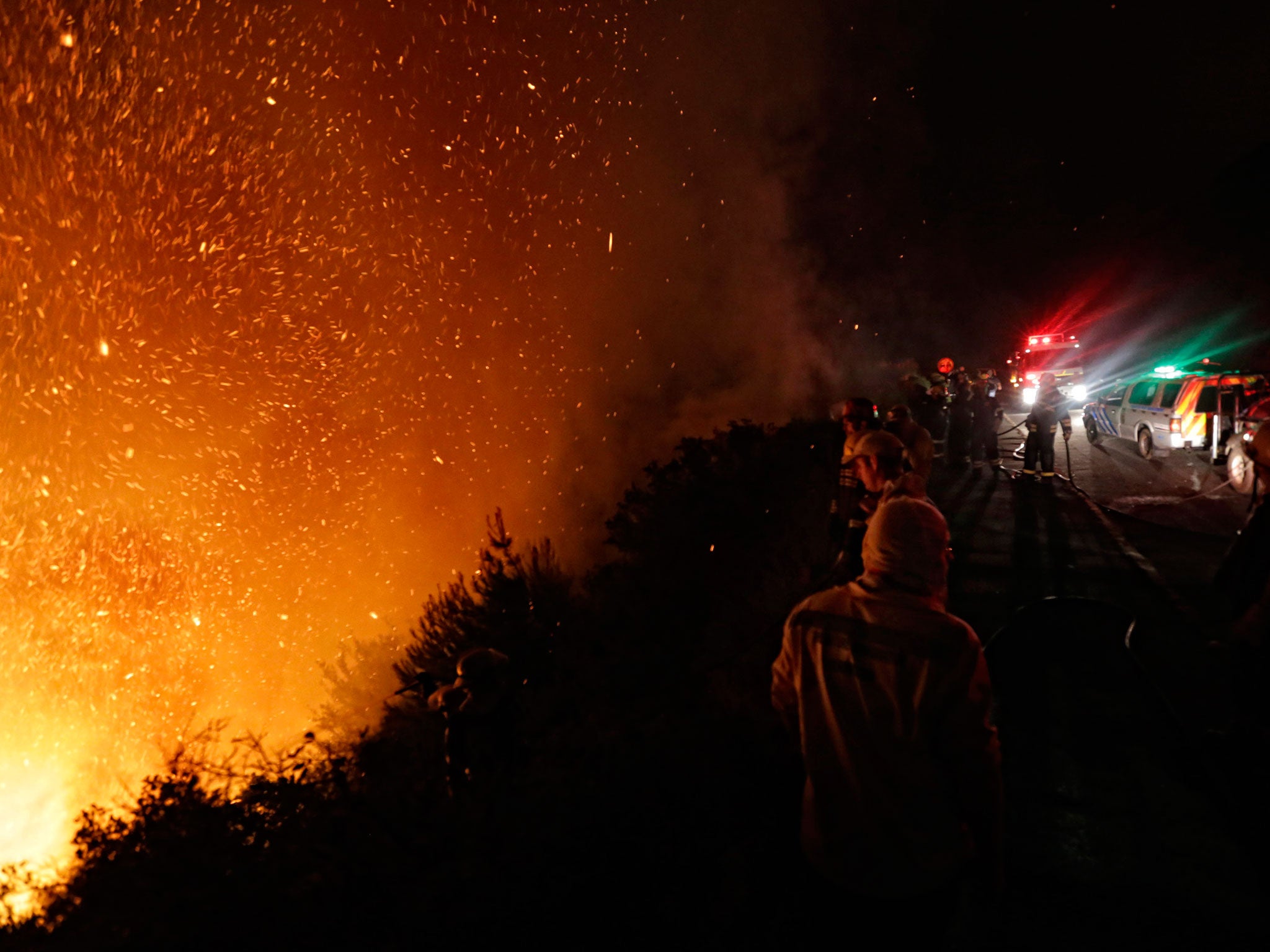 Firemen battle a blaze near Cape Town