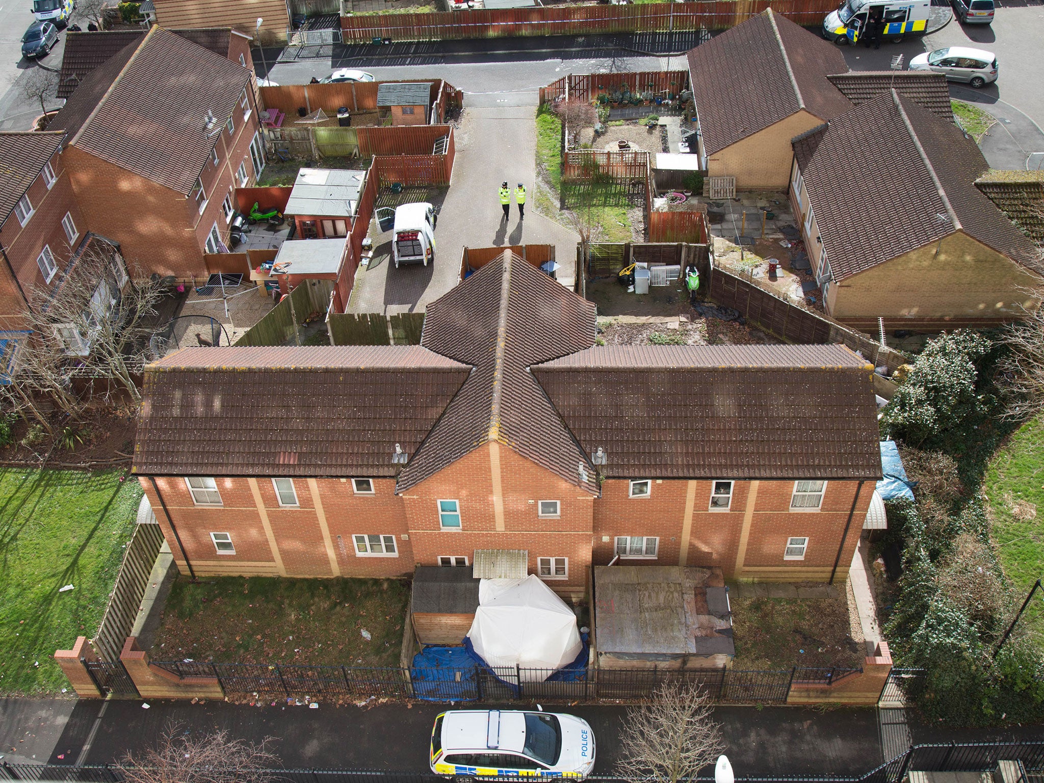 A police foresic tent is seen outside a property in Barton Court