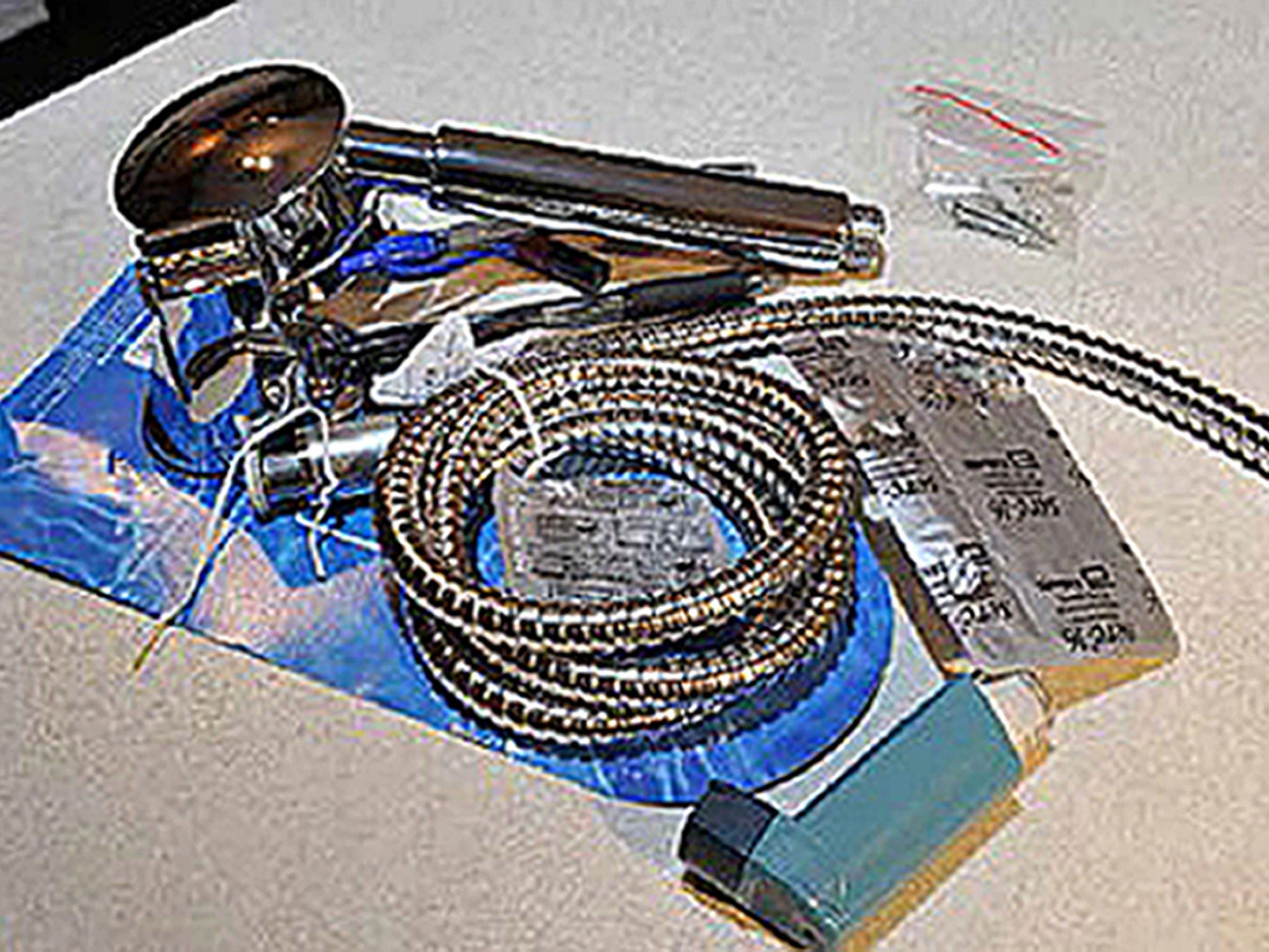 A new shower hose and fitting purchased by Kiki Muddar found inside the flat at Bedwell Court; it is believed this was a replacement for one that had been used to assault Ayesha Ali