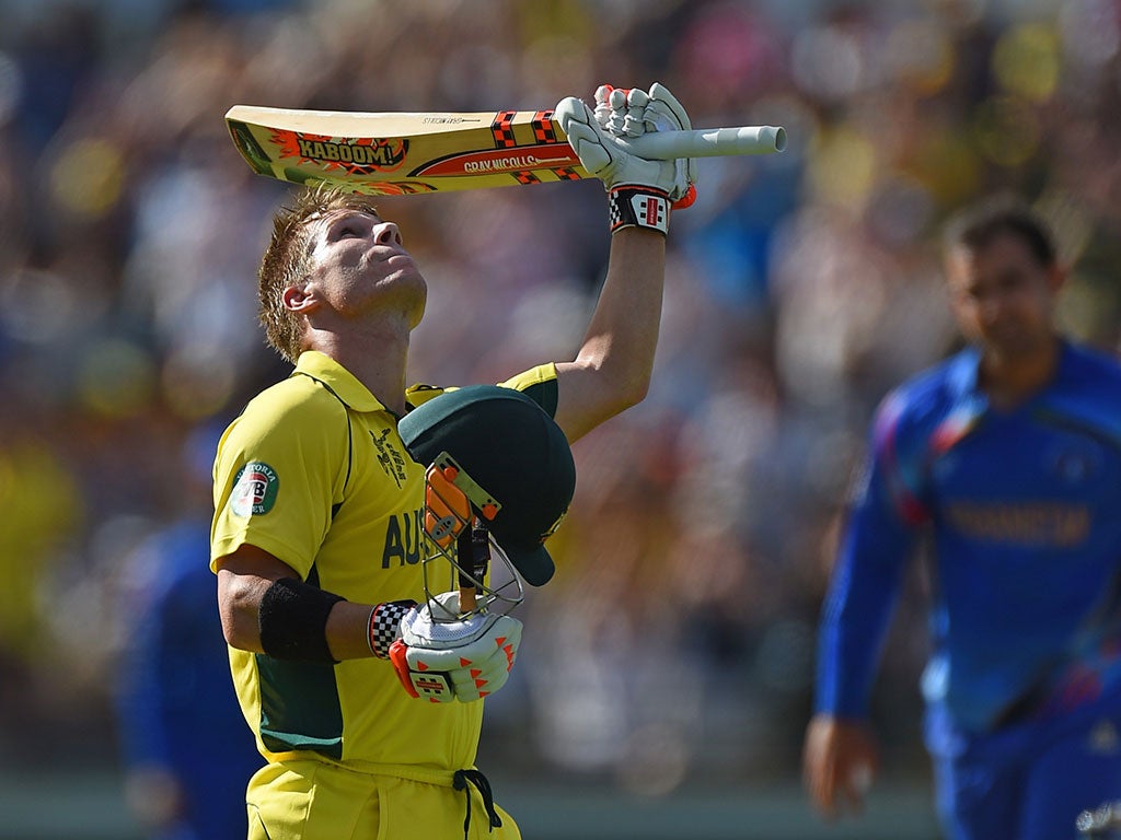 David Warner looks to the sky as he reaches his century in the win over Afghanistan