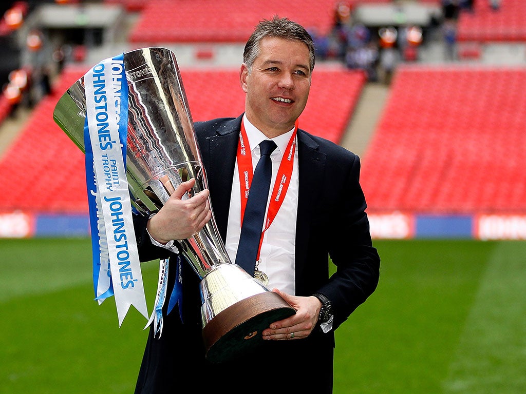 Peterborough manager Darren Ferguson celebrates with the Football League Trophy