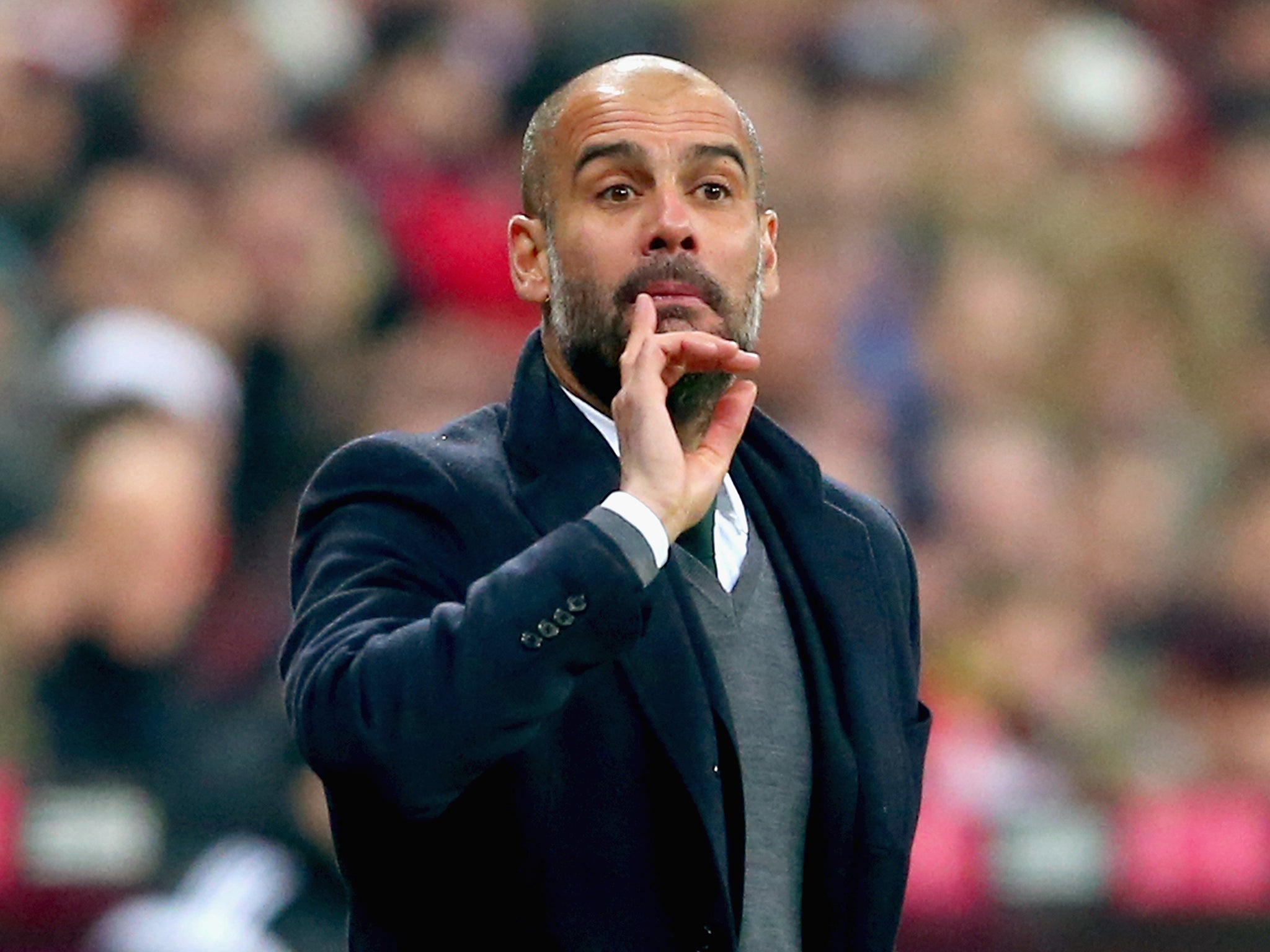 Pep Guardiola makes a point form the touchline