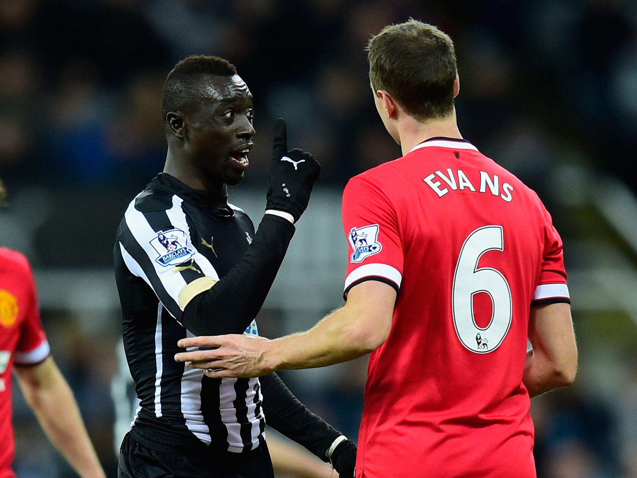 Johnny Evans and Papiss Cisse come together