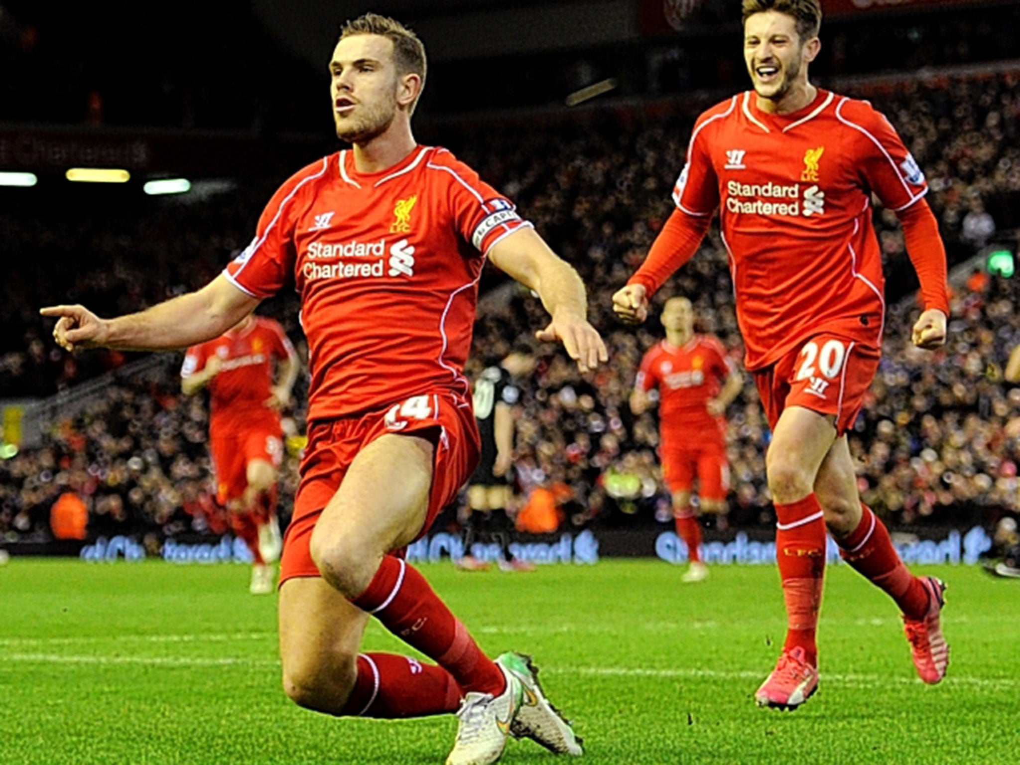 Liverpool’s Jordan Henderson celebrates his goal against Burnley