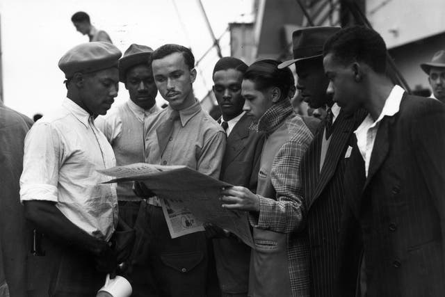 <p>Jamaican men on board the Empire Windrush in 1948</p>