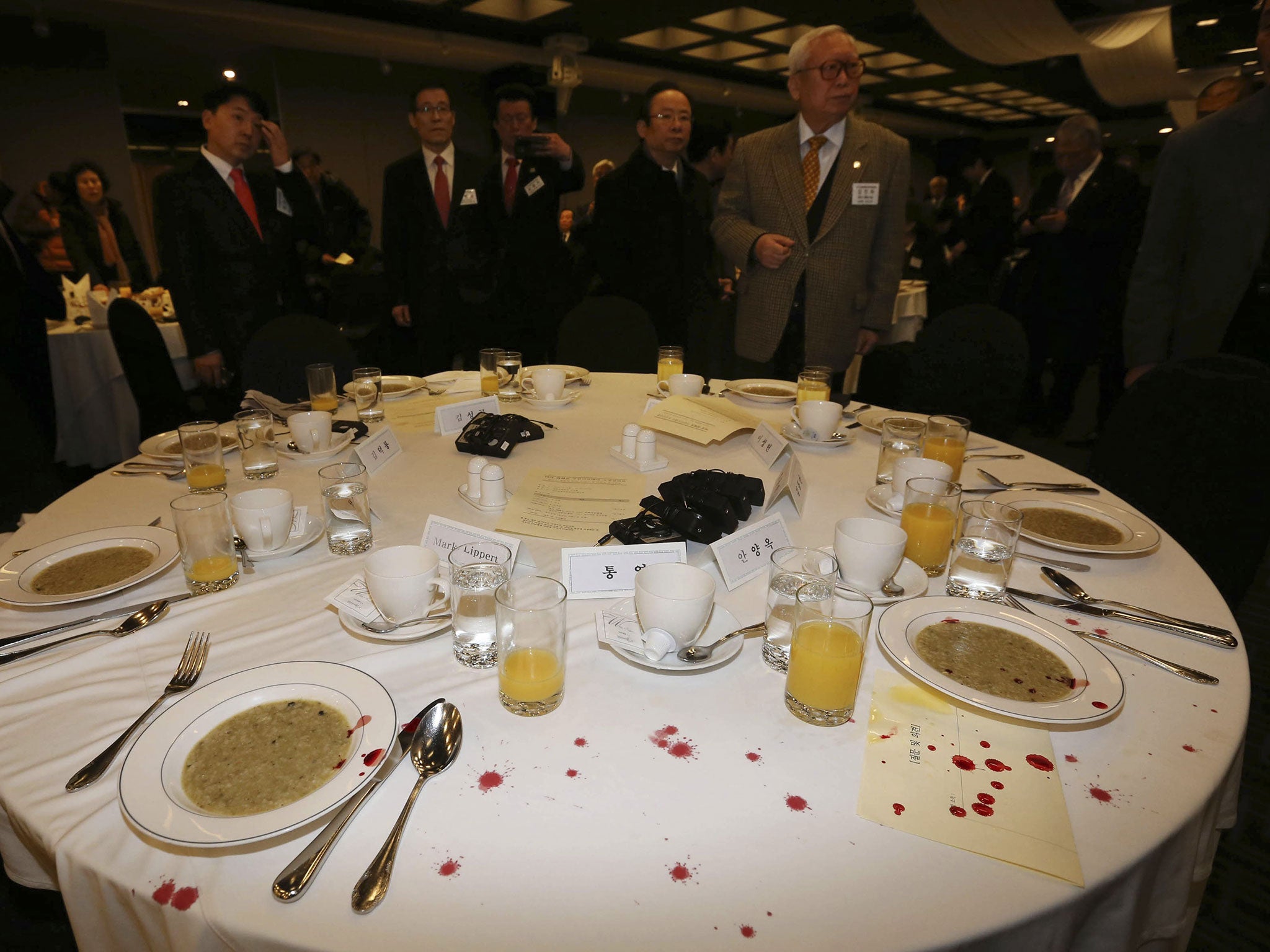 Blood stains from the US ambassador are seen on a table following his evacuation